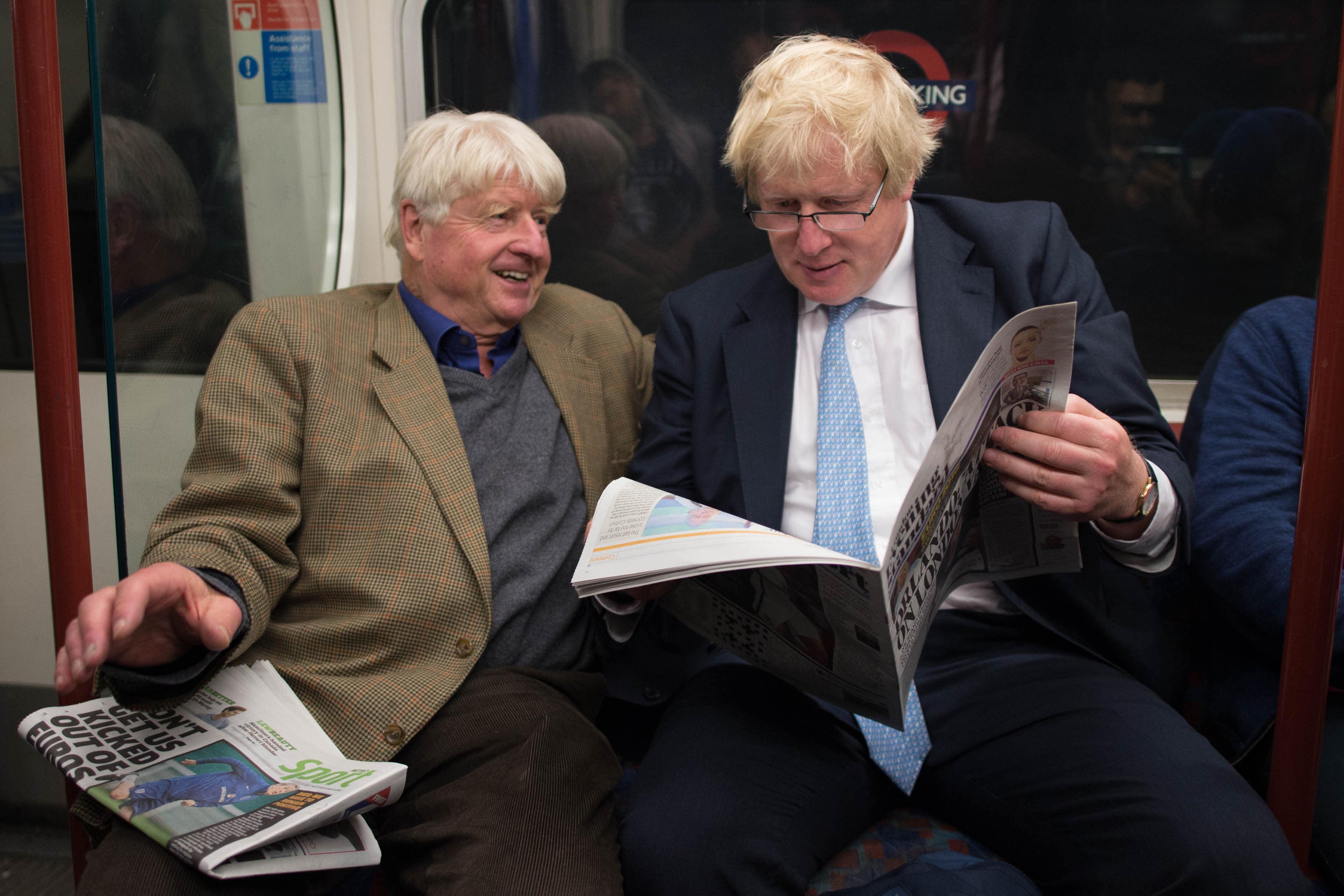 Boris Johnson sits next to his father Stanley (left) on the Bakerloo Line