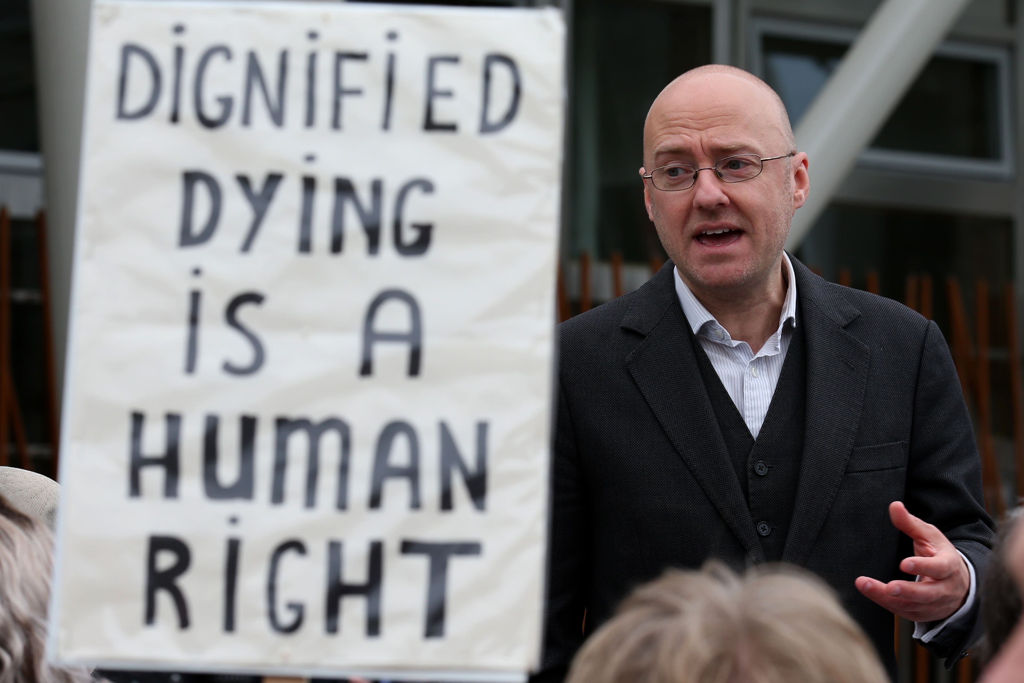 Assisted Suicide Bill supporter Patrick Harvie (centre), speaks with representatives of My Life, My Death, My Choice, outside the Scottish Parliament, ahead of debate of the Assisted Suicide (Scotland) Bill, which would allow those with terminal or life-shortening illnesses to obtain help to end their suffering (Andrew Milligan/PA)