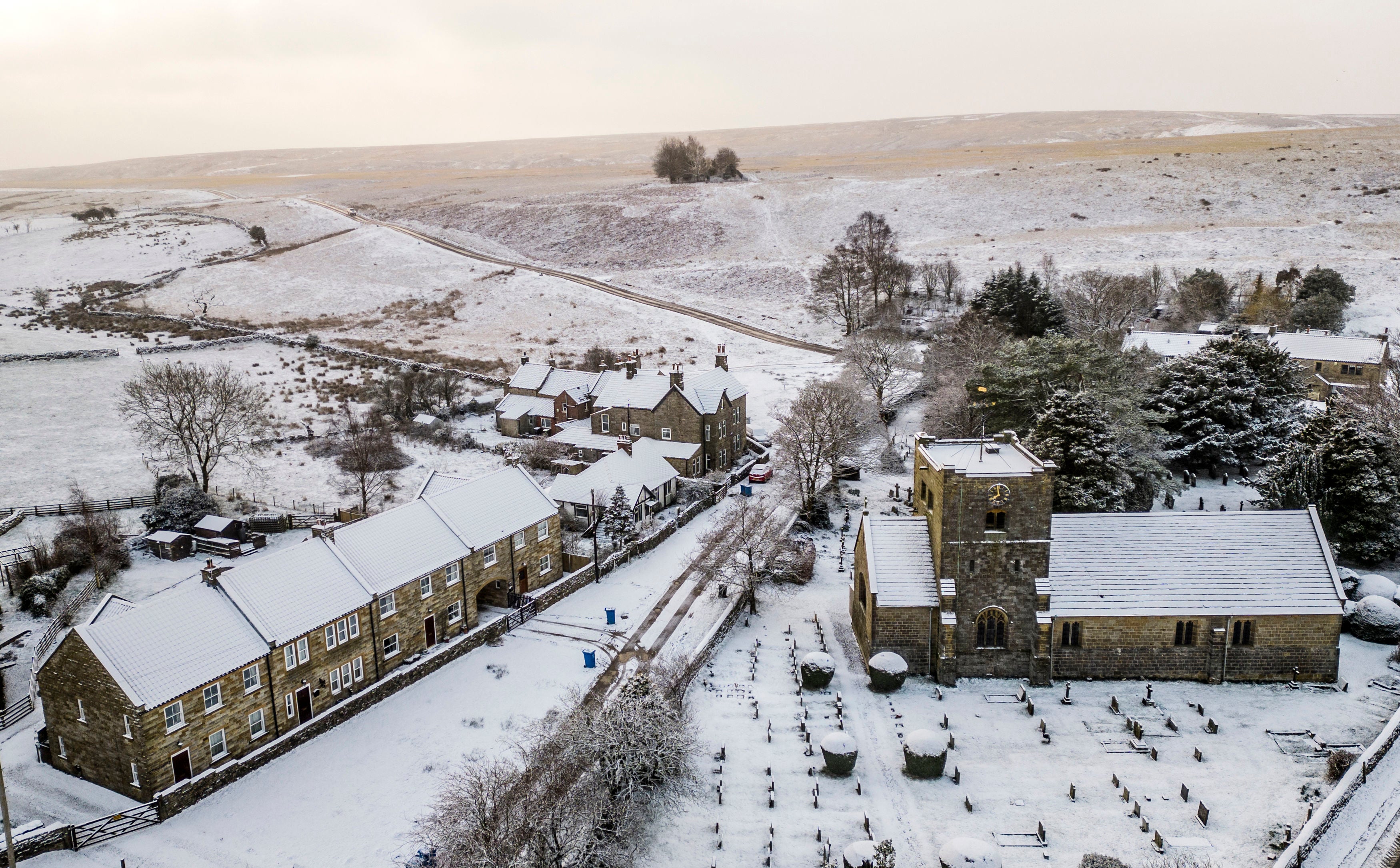 St Mary's Church in Goathland, North Yorkshire, is surrounded by snow as weather warnings for snow and ice are in place across all four nations of the UK