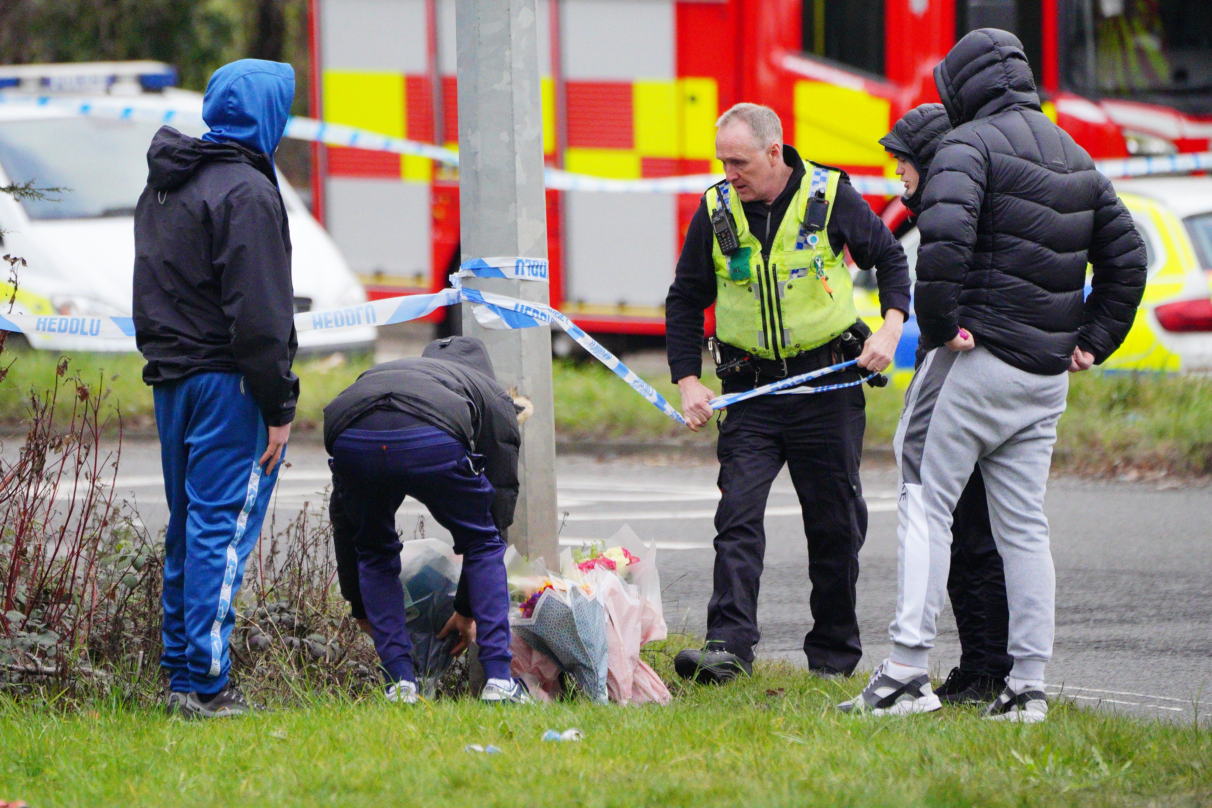 Floral tributes are left near the scene of the crash in Cardiff (PA)