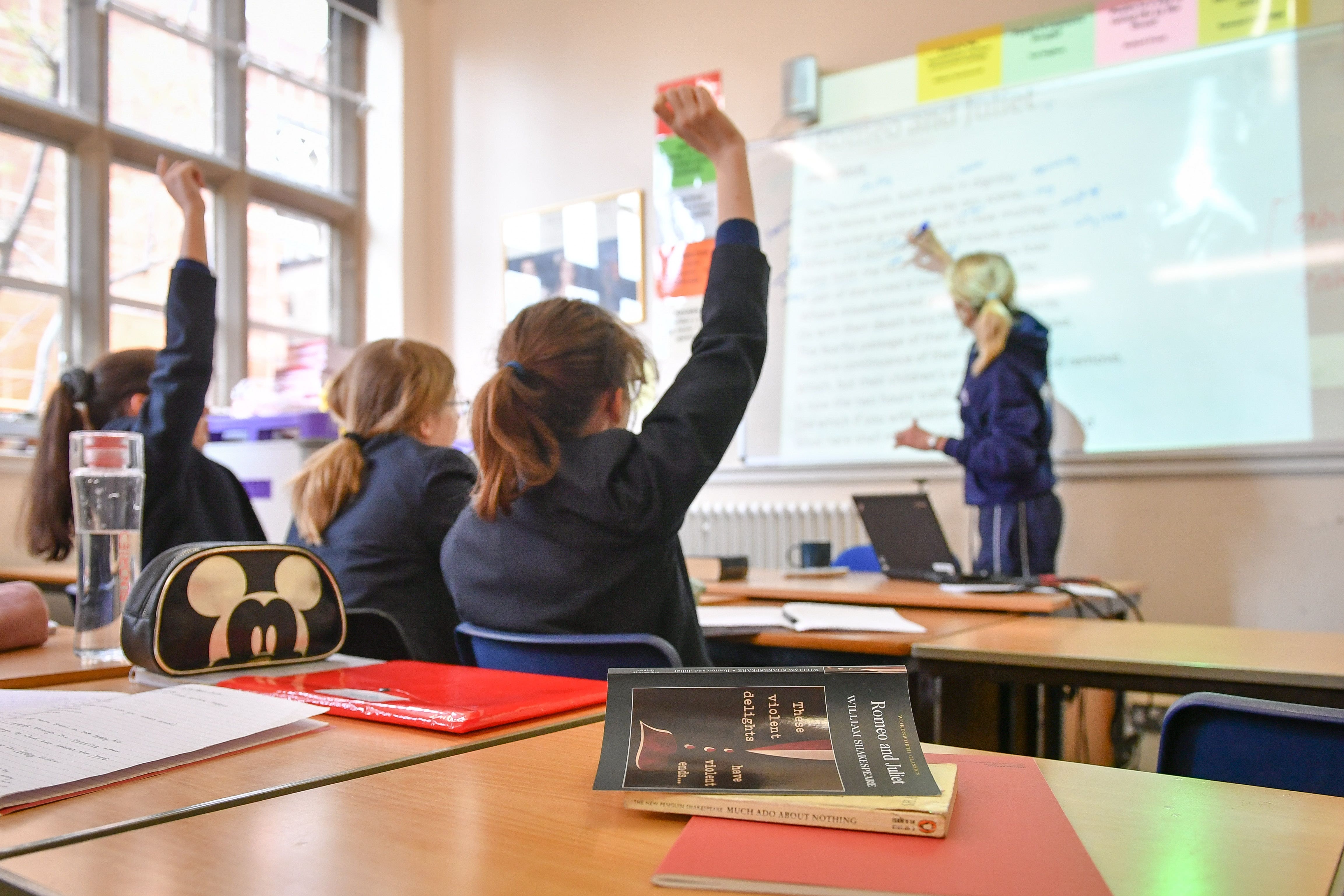 File photo dated 12/09/18 of a teacher and students in a classroom, as design and technology pupils should be focusing on designing solutions to global challenges rather than creating products which often end up in landfill, one of the UK’s biggest education companies has suggested.