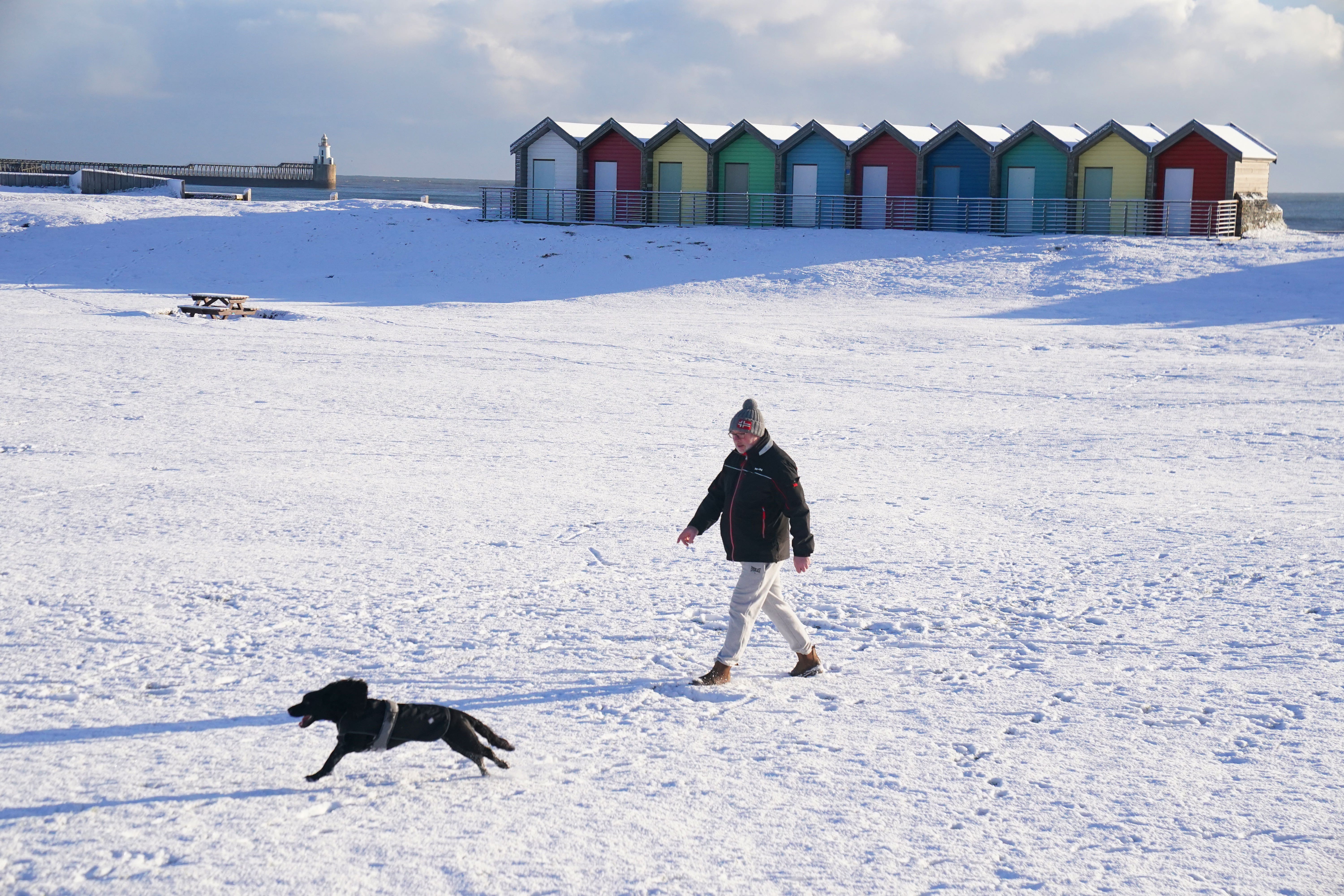 More sleet and snow are expected across southern England and south Wales on Wednesday while scattered snow and hail showers will impact Scotland’s northern coasts as the Artic blast intensifies (Owen Humphreys/PA)