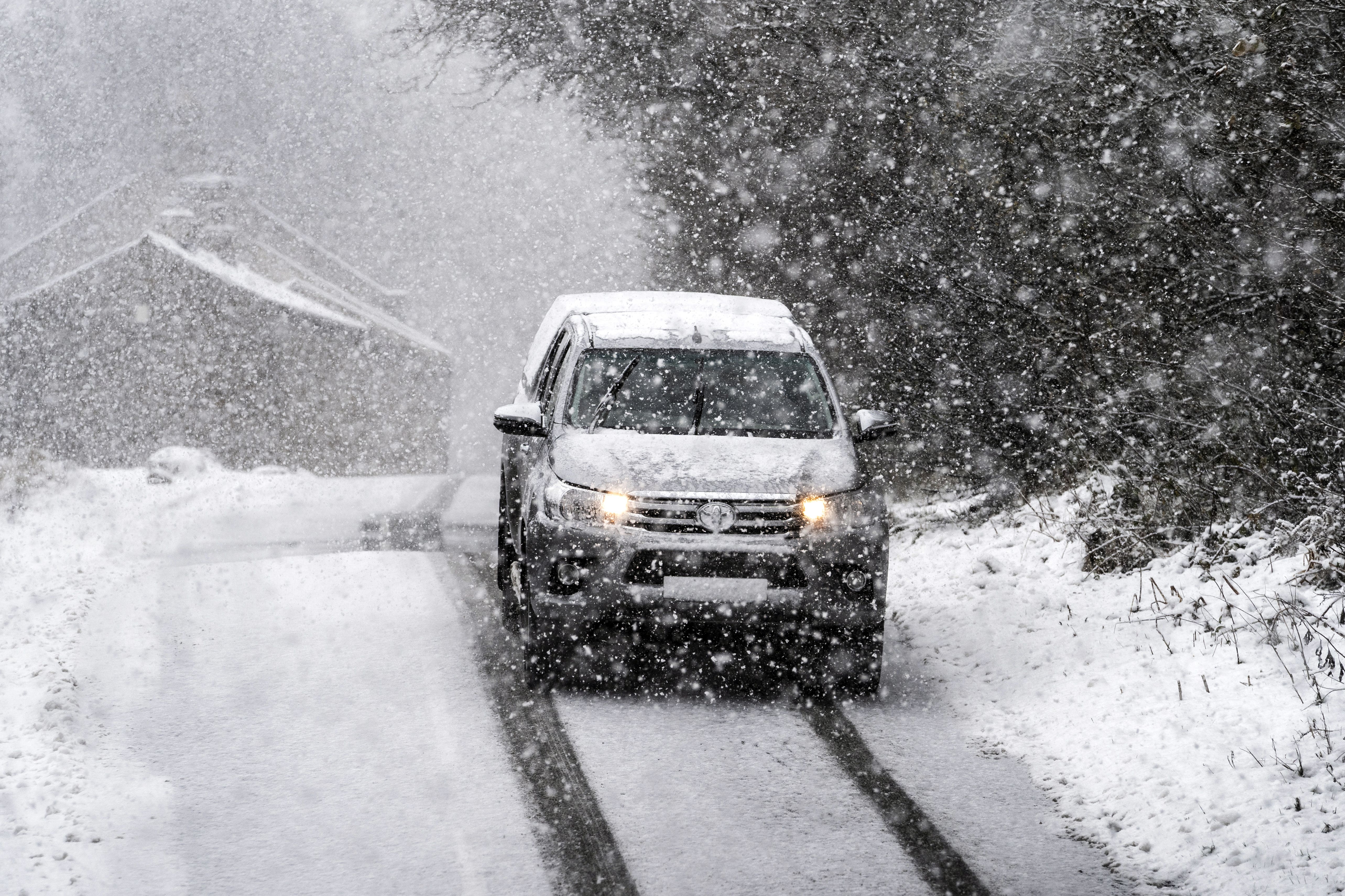 It is illegal to drive with a windscreen covered in snow and ice (Danny Lawson/PA)