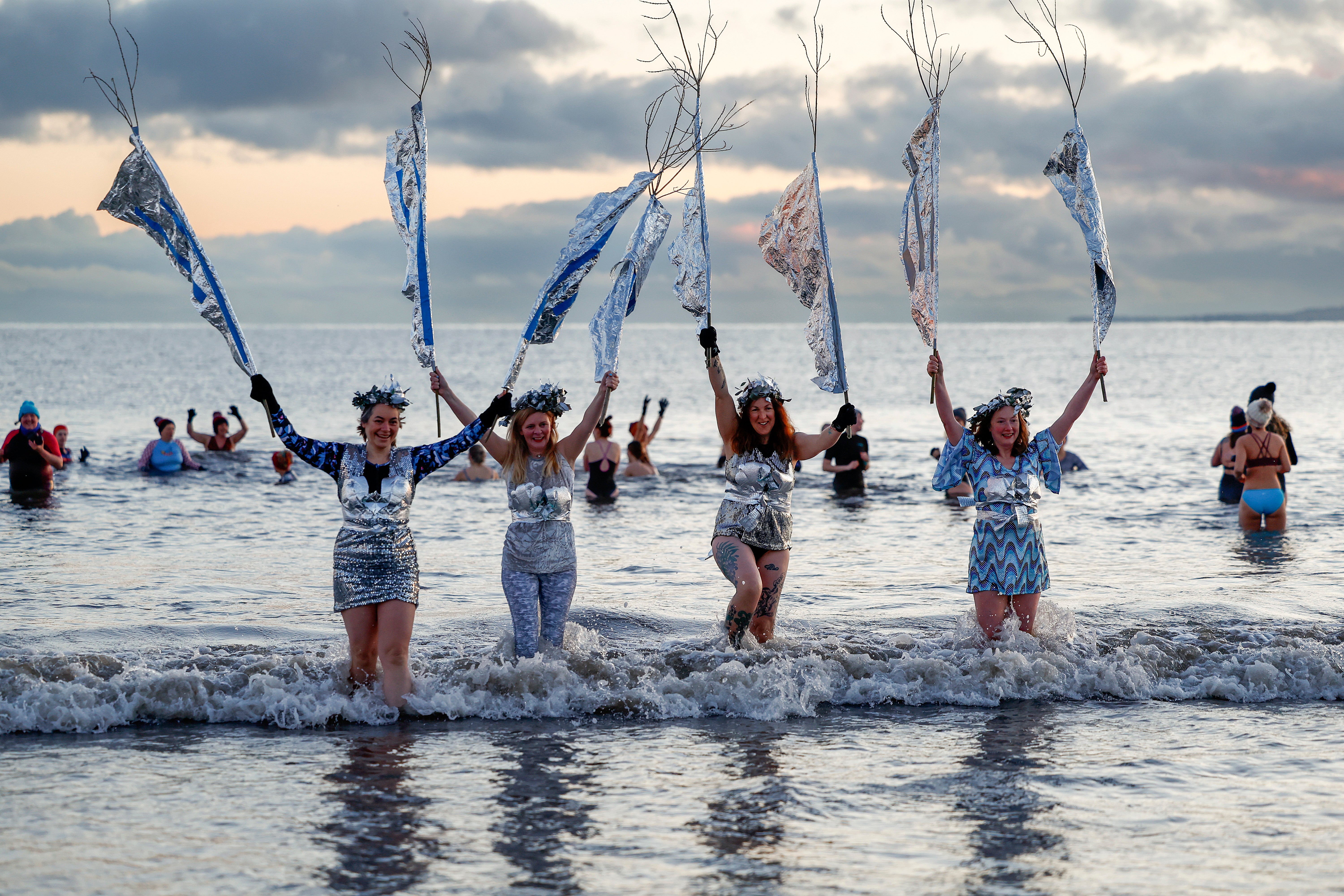 Hundreds of swimmers took a sunrise dip in the North Sea at Portobello Beach