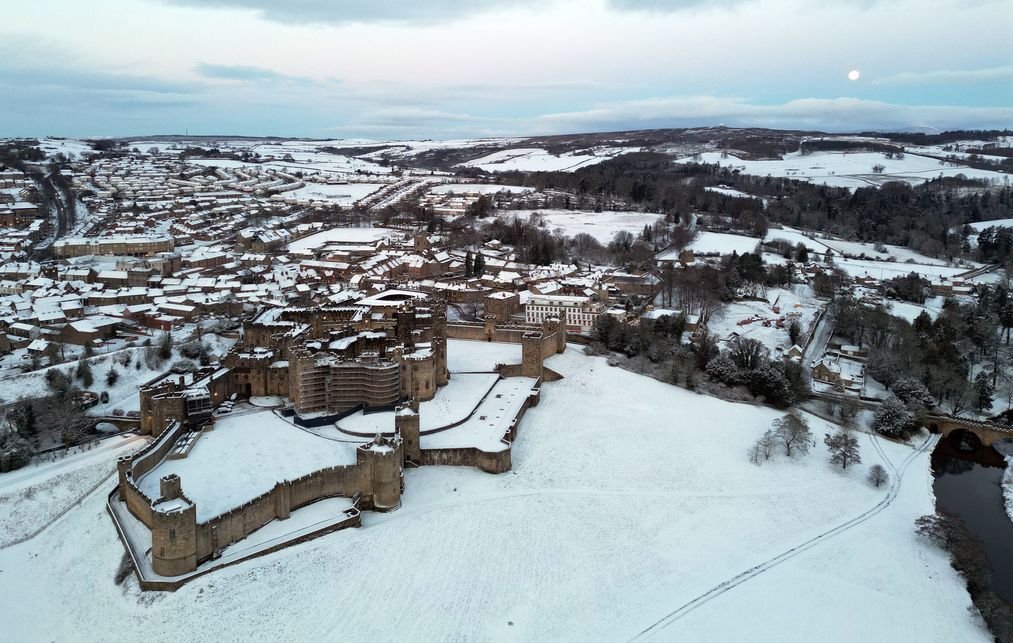 Snow covered fields surround Alnwick Castle in Northumberland as weather warnings for snow and ice are issued