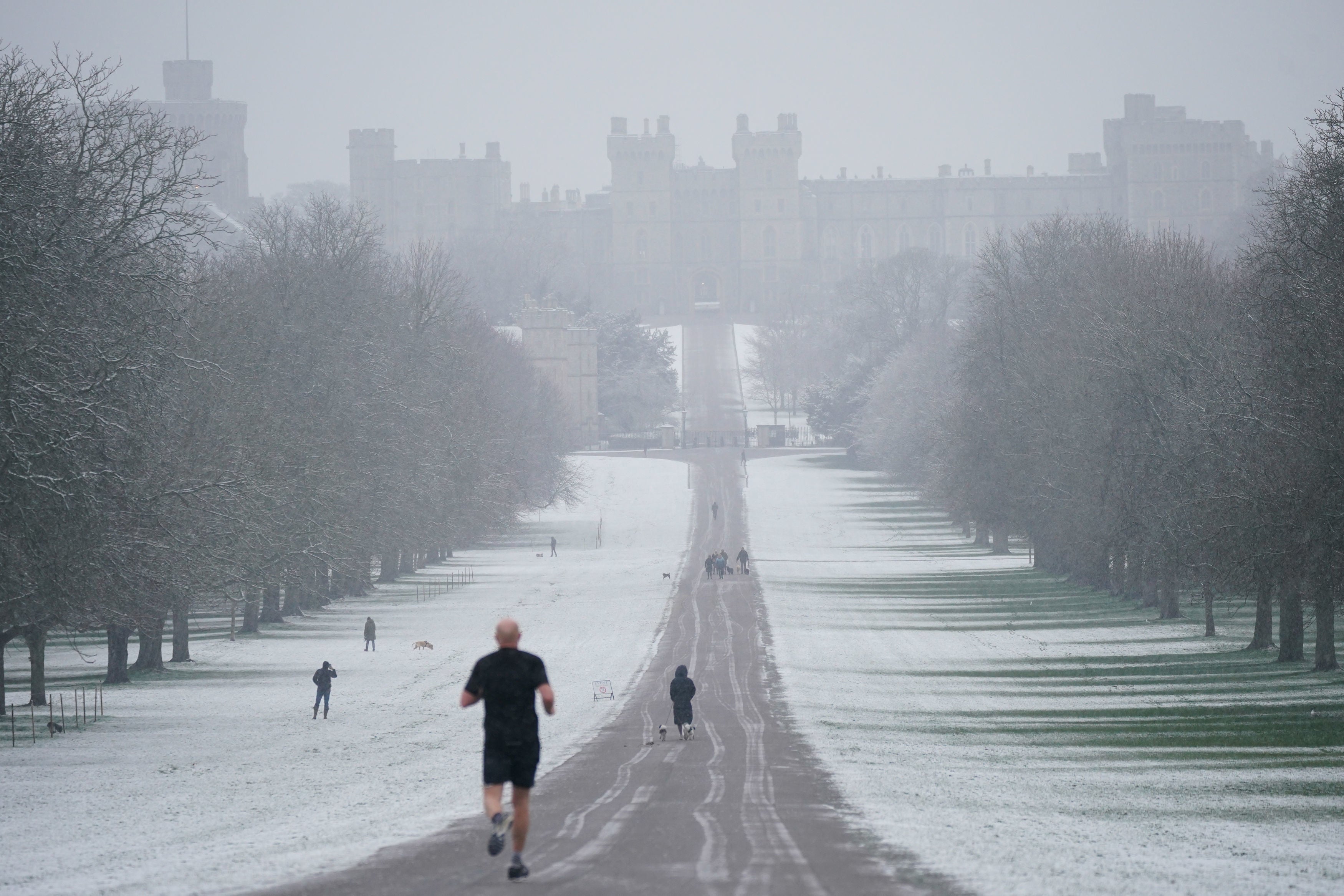 A snowy scene looking along the Long Walk towards Windsor Castle, Berkshire