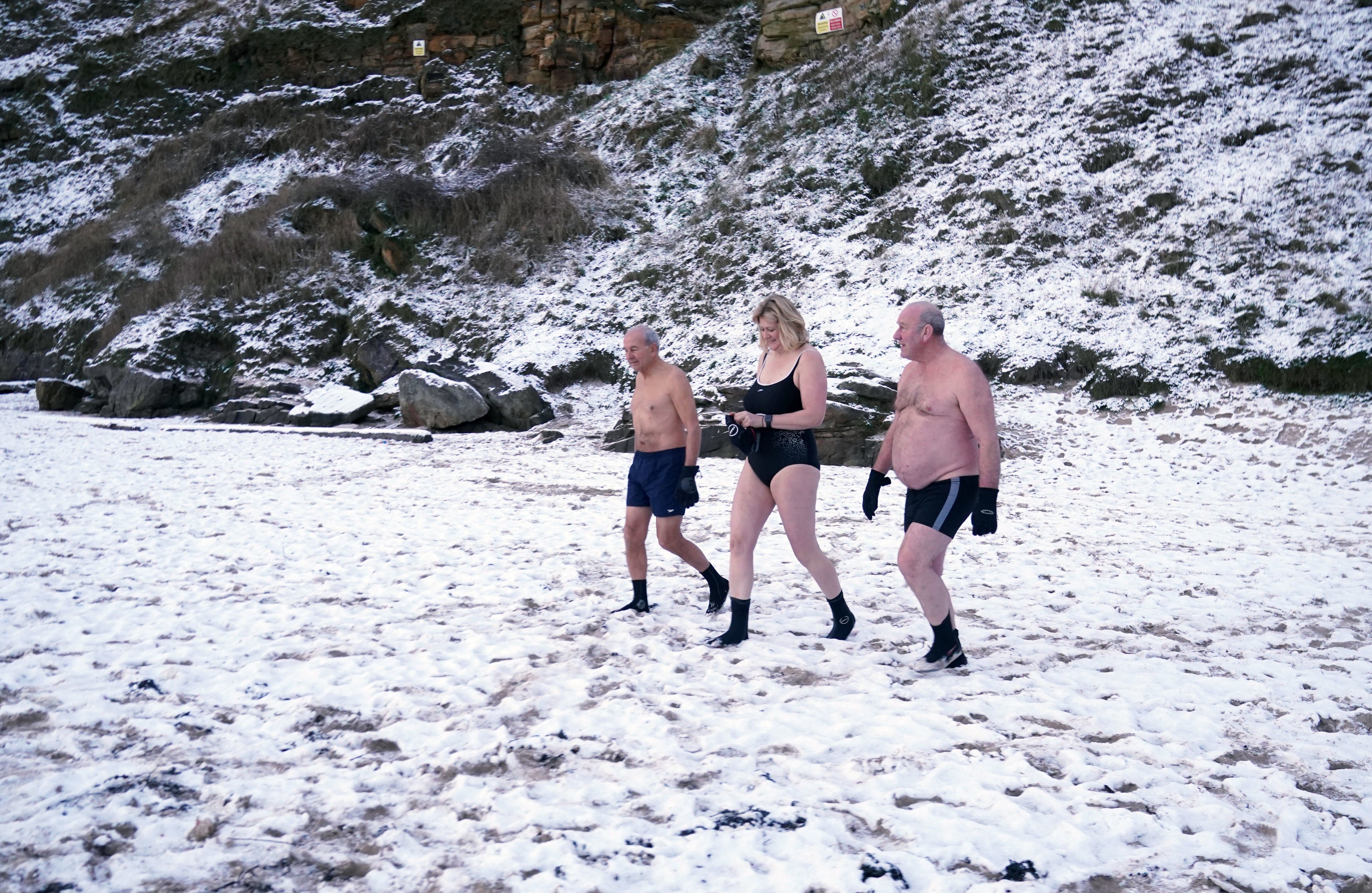 Early morning swimmers brave the cold at King Edward’s Bay, near Tynemouth on the North East coast of England