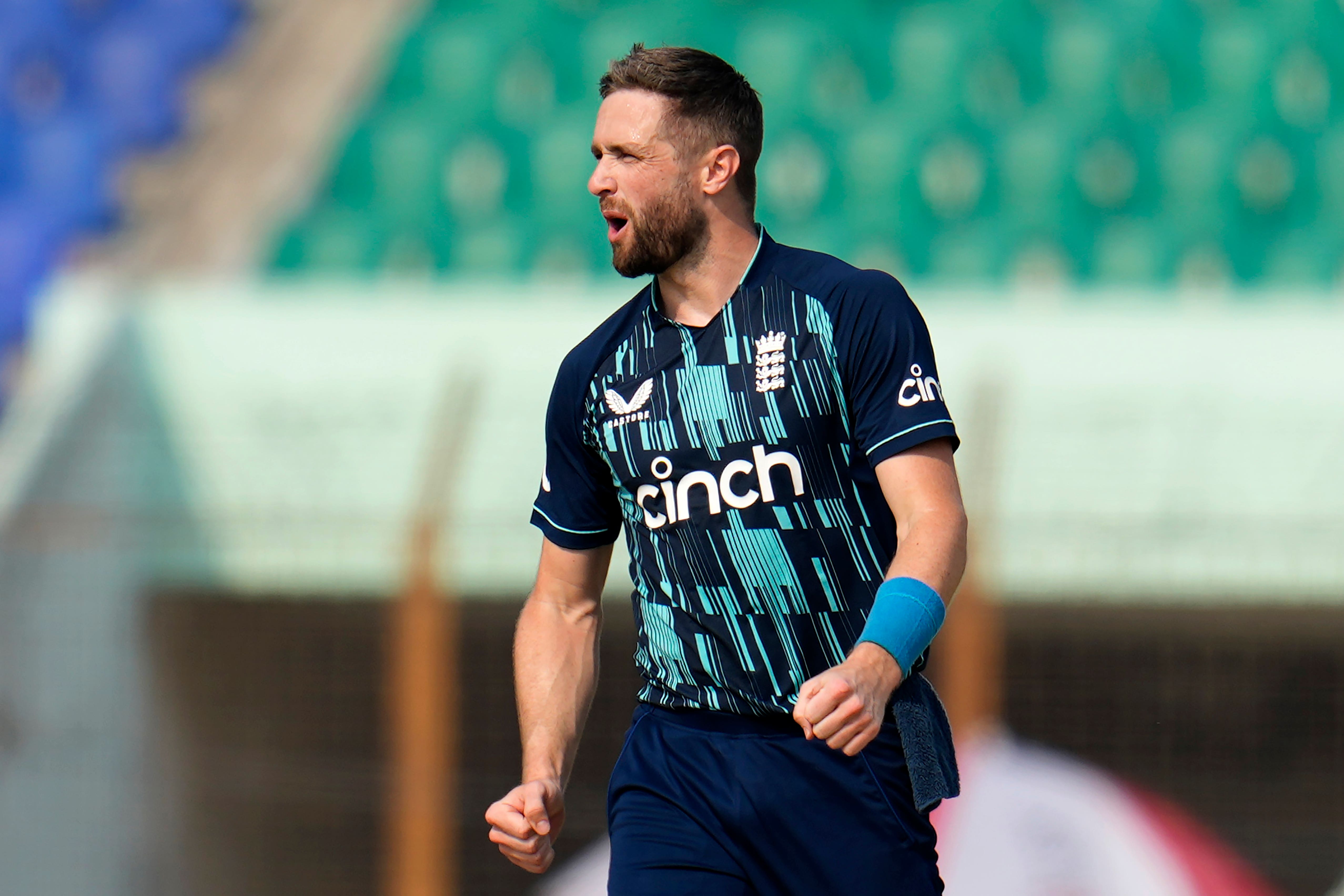 England’s Chris Woakes celebrates the dismissal against Bangladesh (Aijaz Rahi/AP).