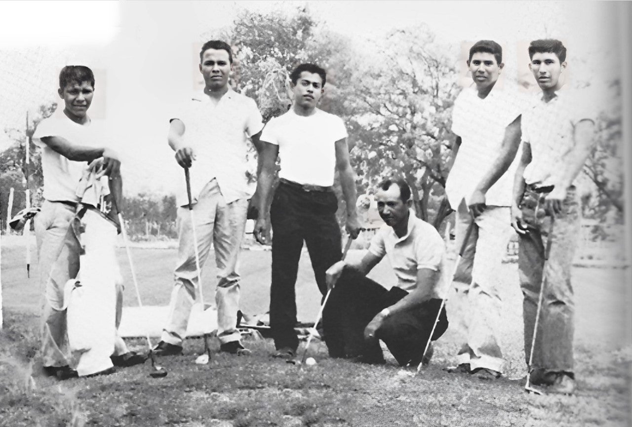 San Felipe Superintendent JB Peña, kneeling, stands with the Mexican American high school golf team he recruited from country club caddies