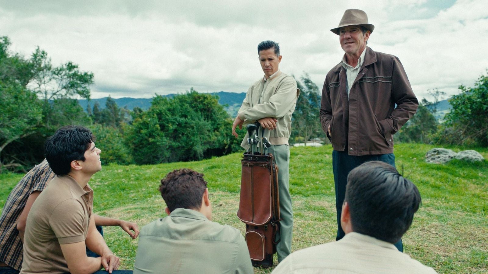 Jay Hernandez and Dennis Quaid portray JB Peña and Hasim Valdes, the real-life men who coached the San Felipe team to victory, in The Long Game