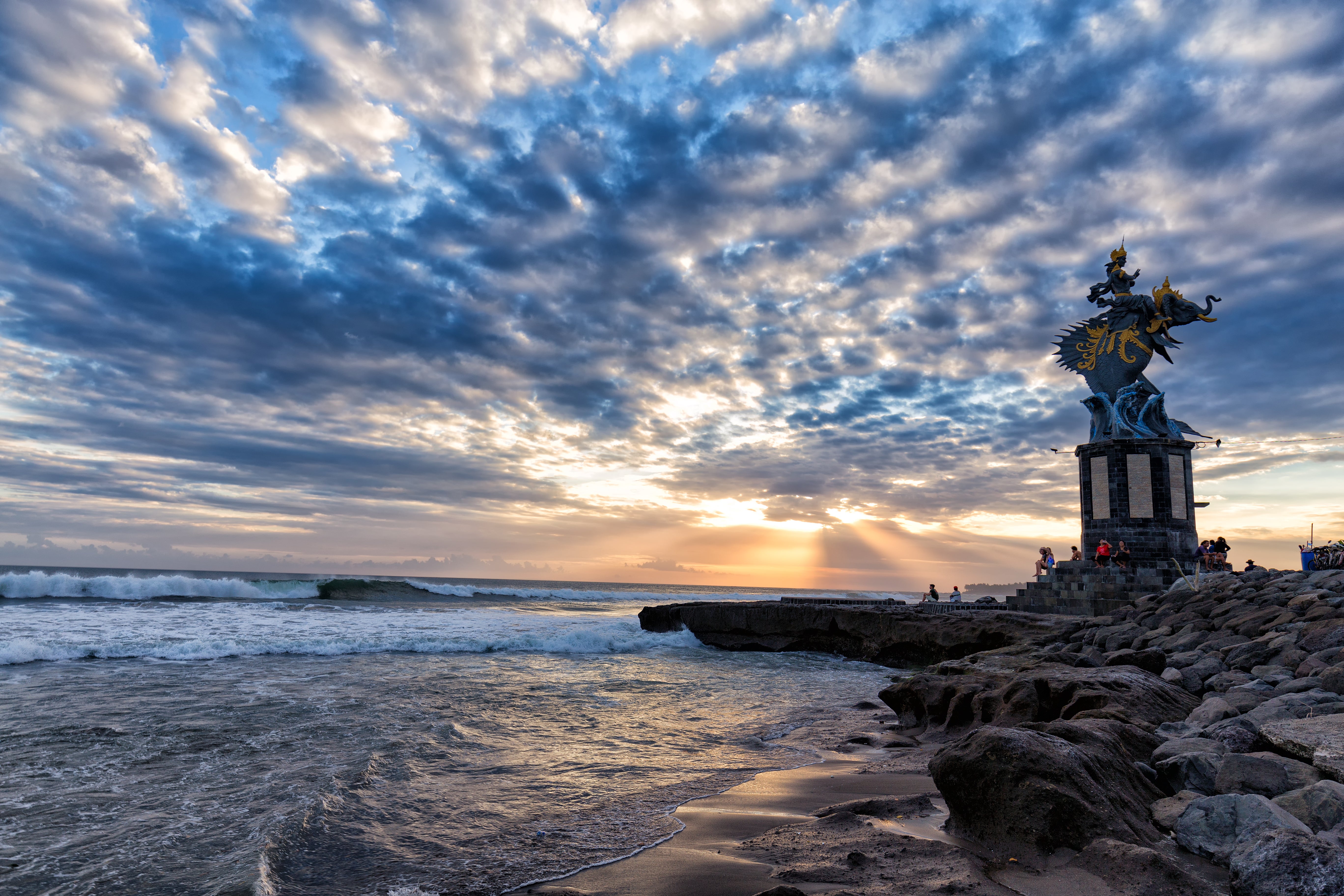 A British pensioner has died after being swept off the coast of Bali