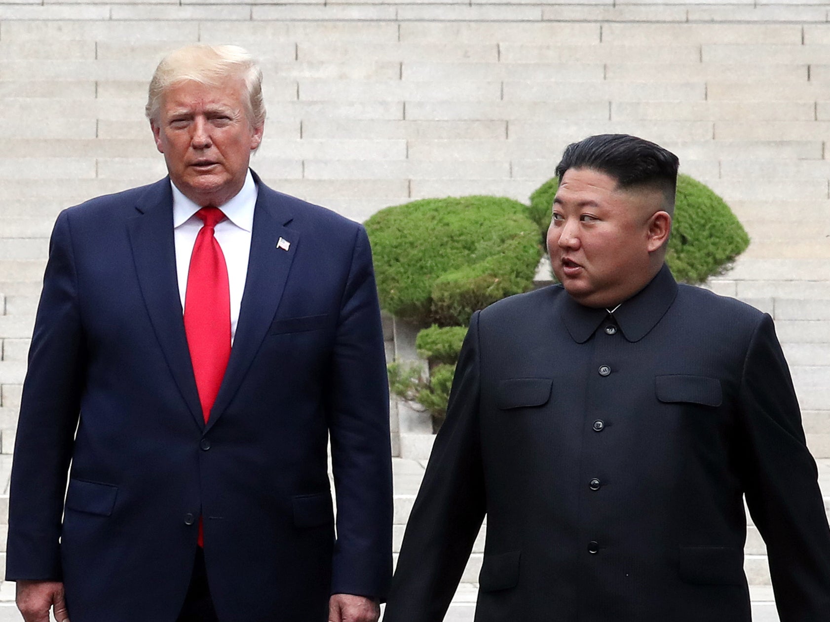 North Korean leader Kim Jong Un and U.S. President Donald Trump inside the demilitarized zone (DMZ) separating the South and North Korea on June 30, 2019