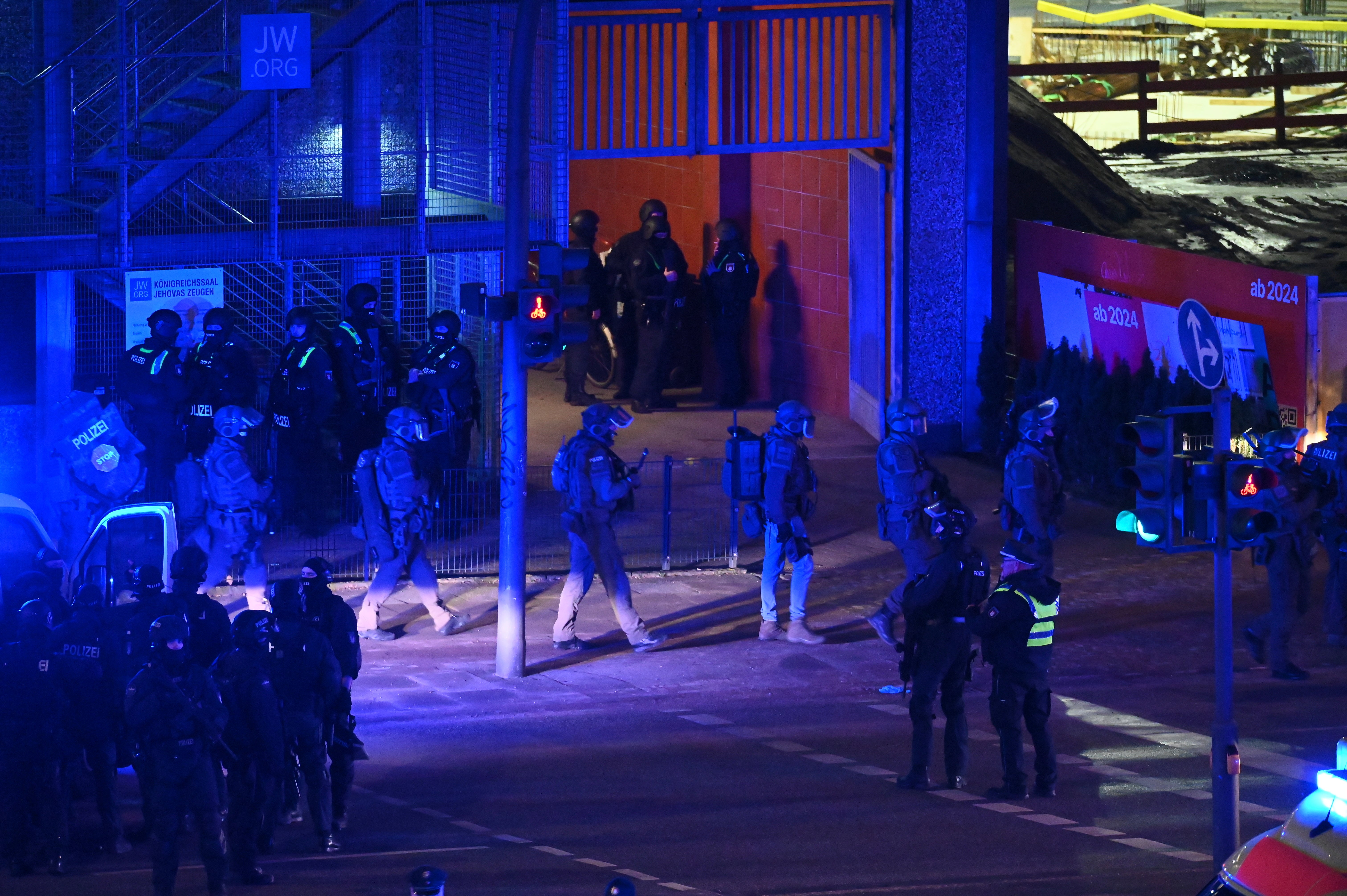 Armed police officers near the scene of a shooting in Hamburg, Germany