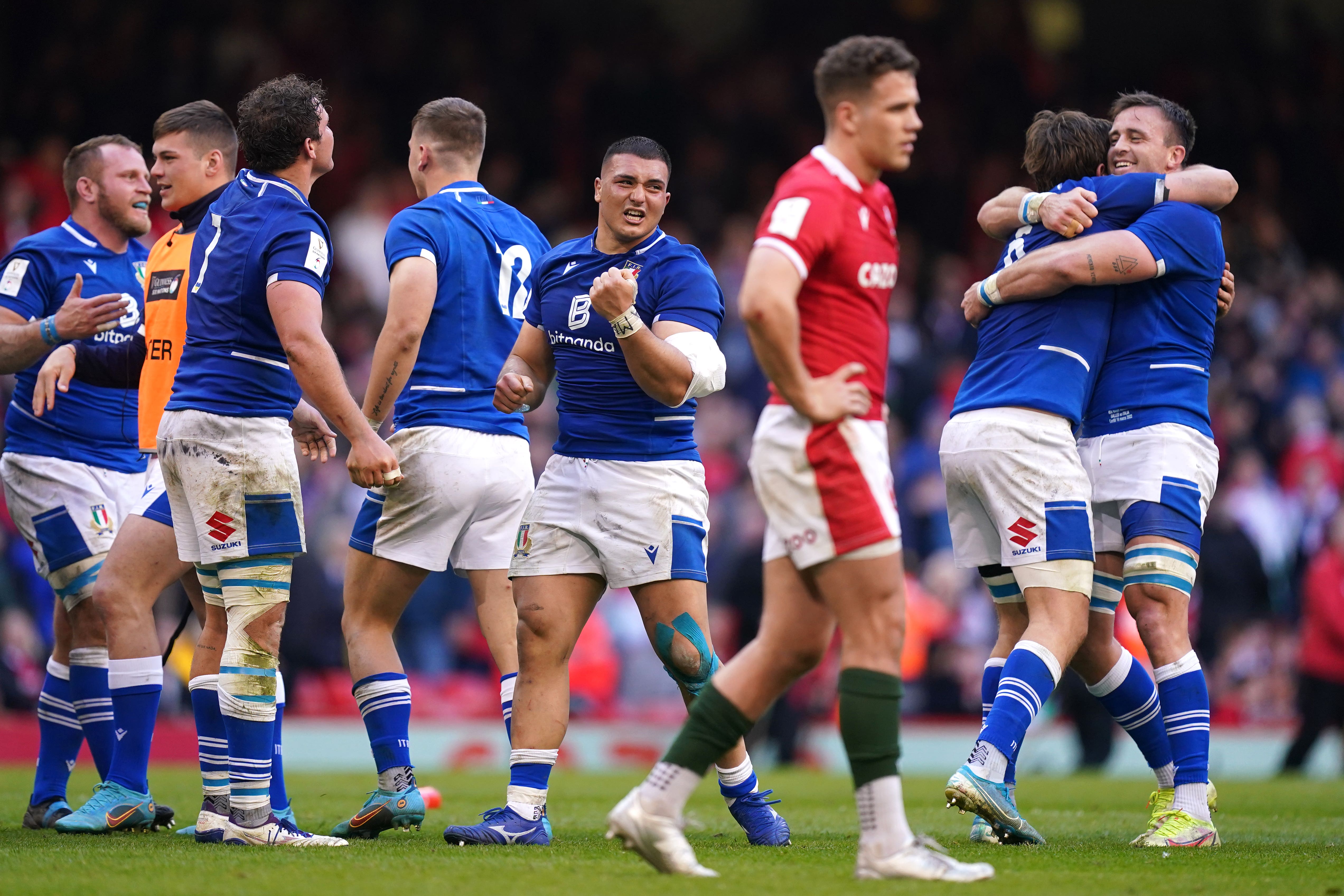 Italy players celebrate after beating Wales in the 2022 Six Nations (Mike Egerton/PA)