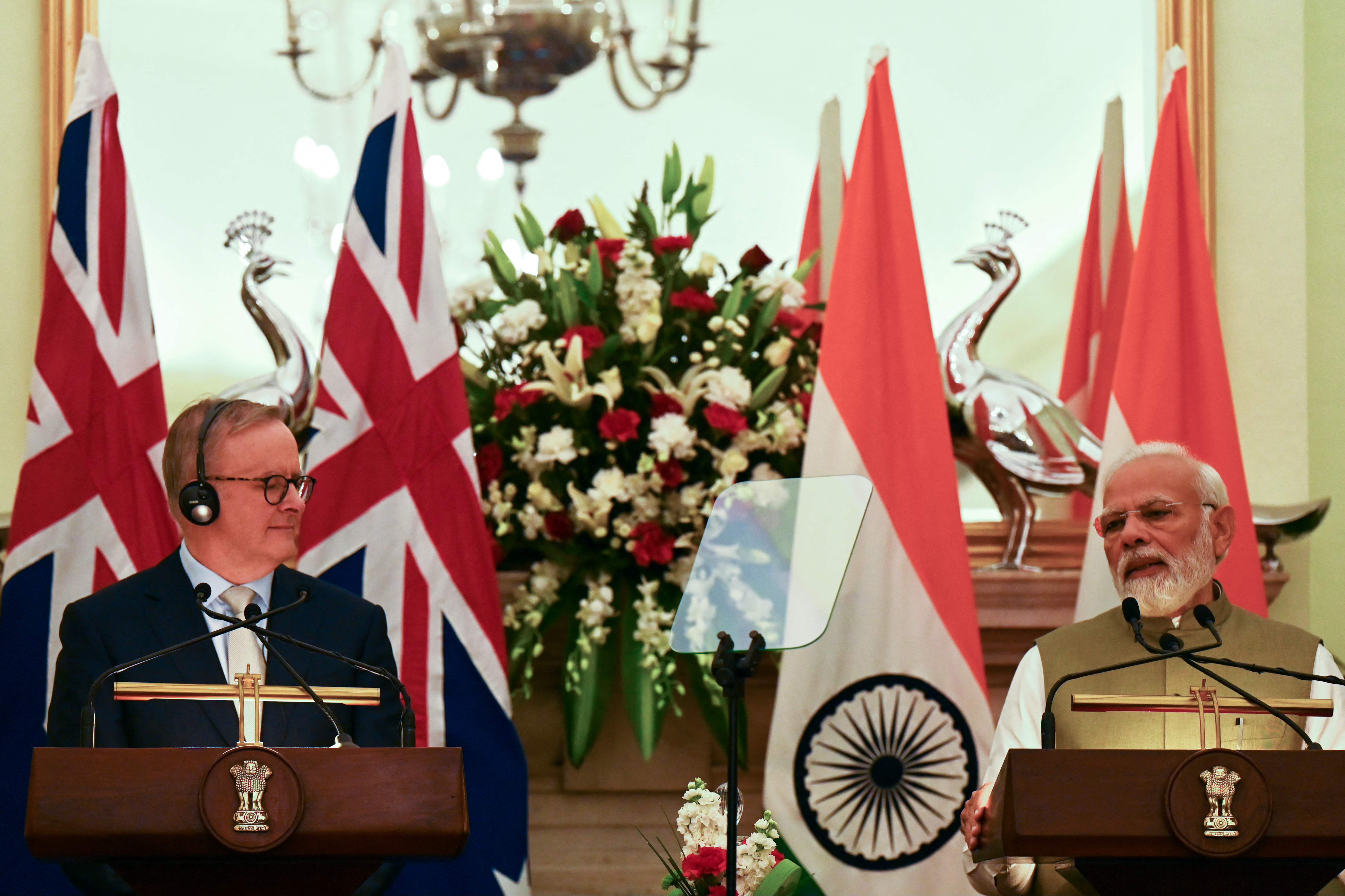 Indian prime minister Narendra Modi speaks next to Australia's prime minister Anthony Albanese during a joint media briefing at Hyderabad House