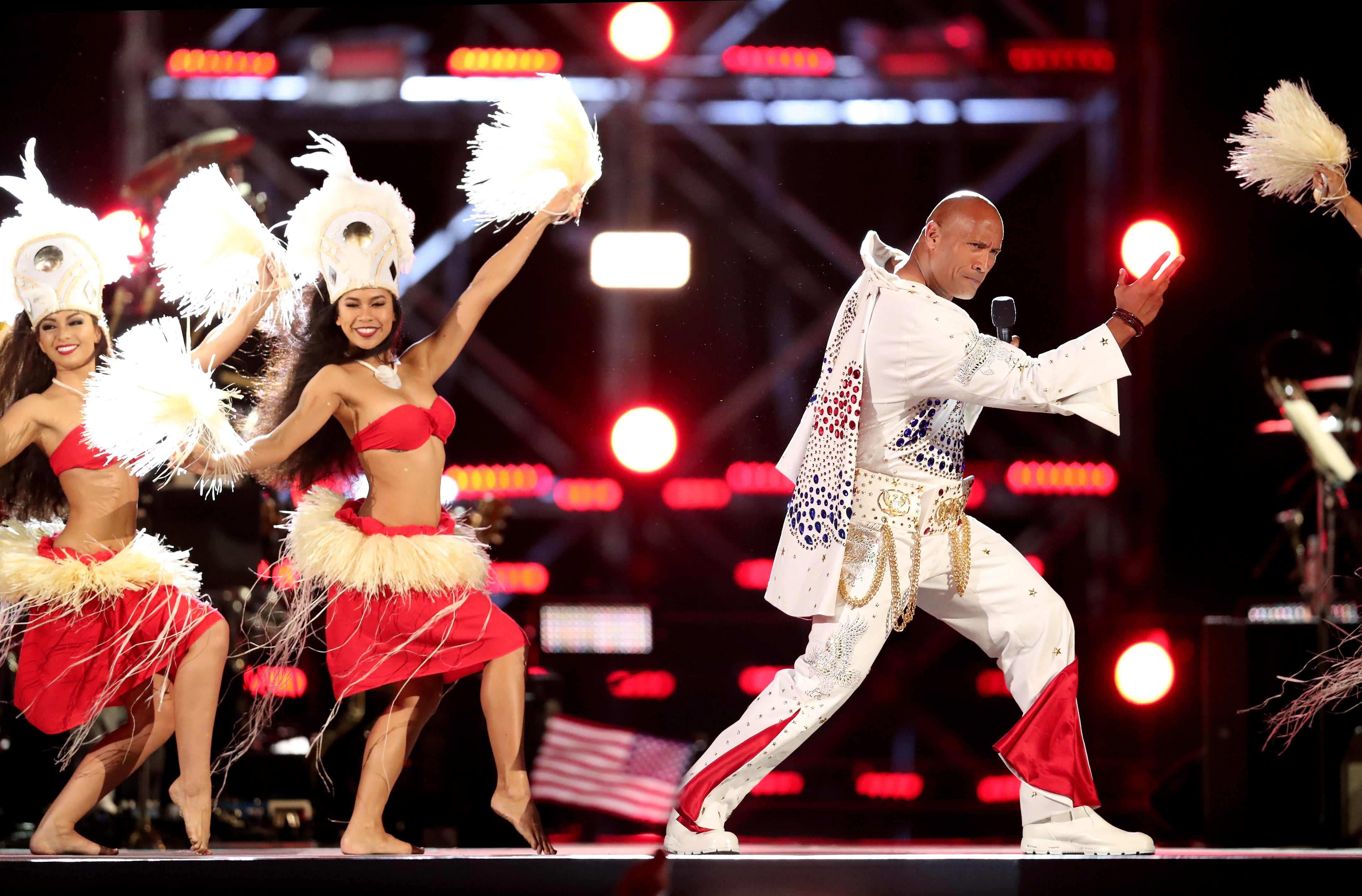 The Rock performs onstage during Spike's “Rock the Troops” event