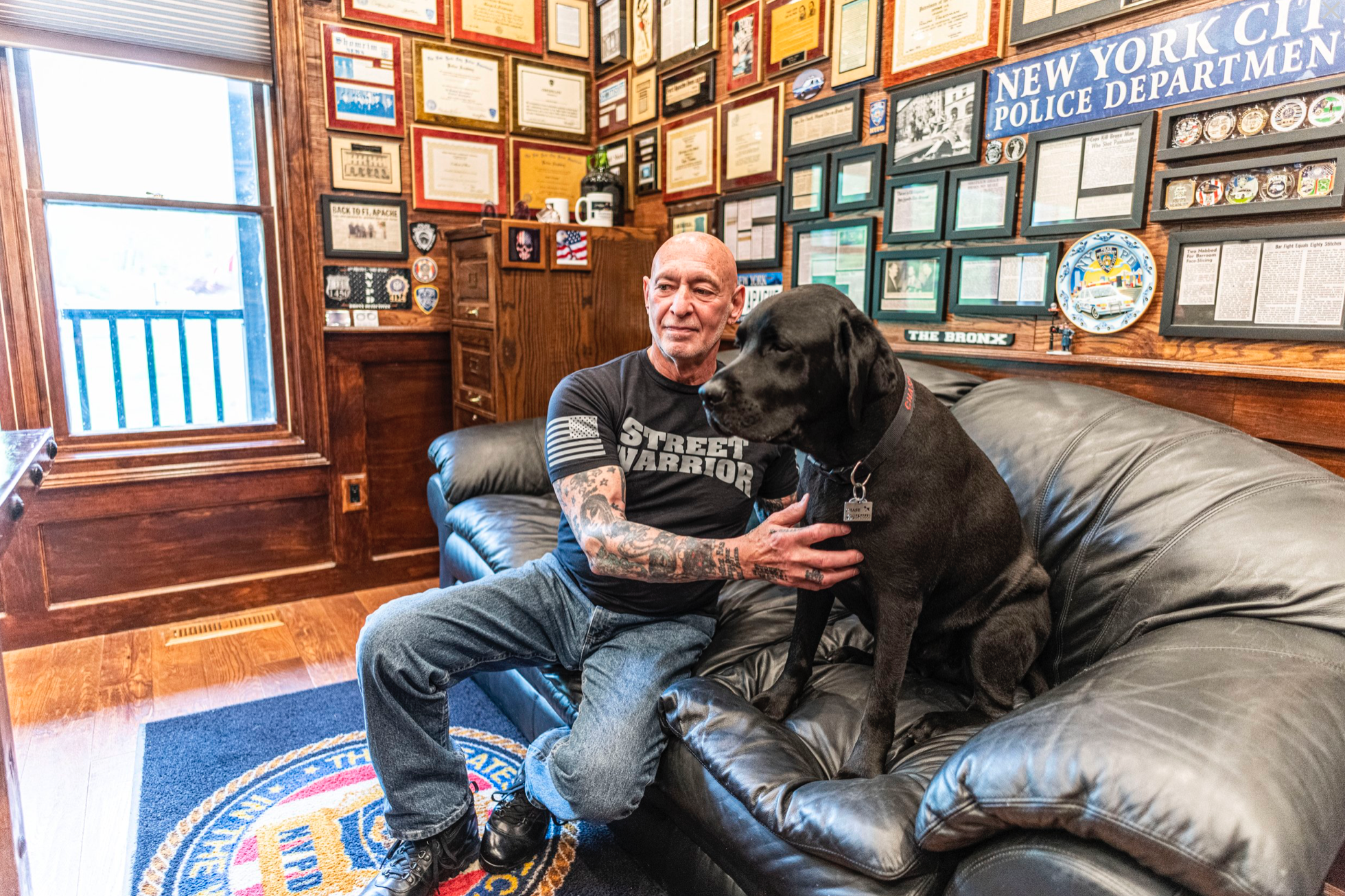Ralph Friedman at home in Fairfield County, Connecticut, with his Chase, his Labrador retriever and personal bodyguard