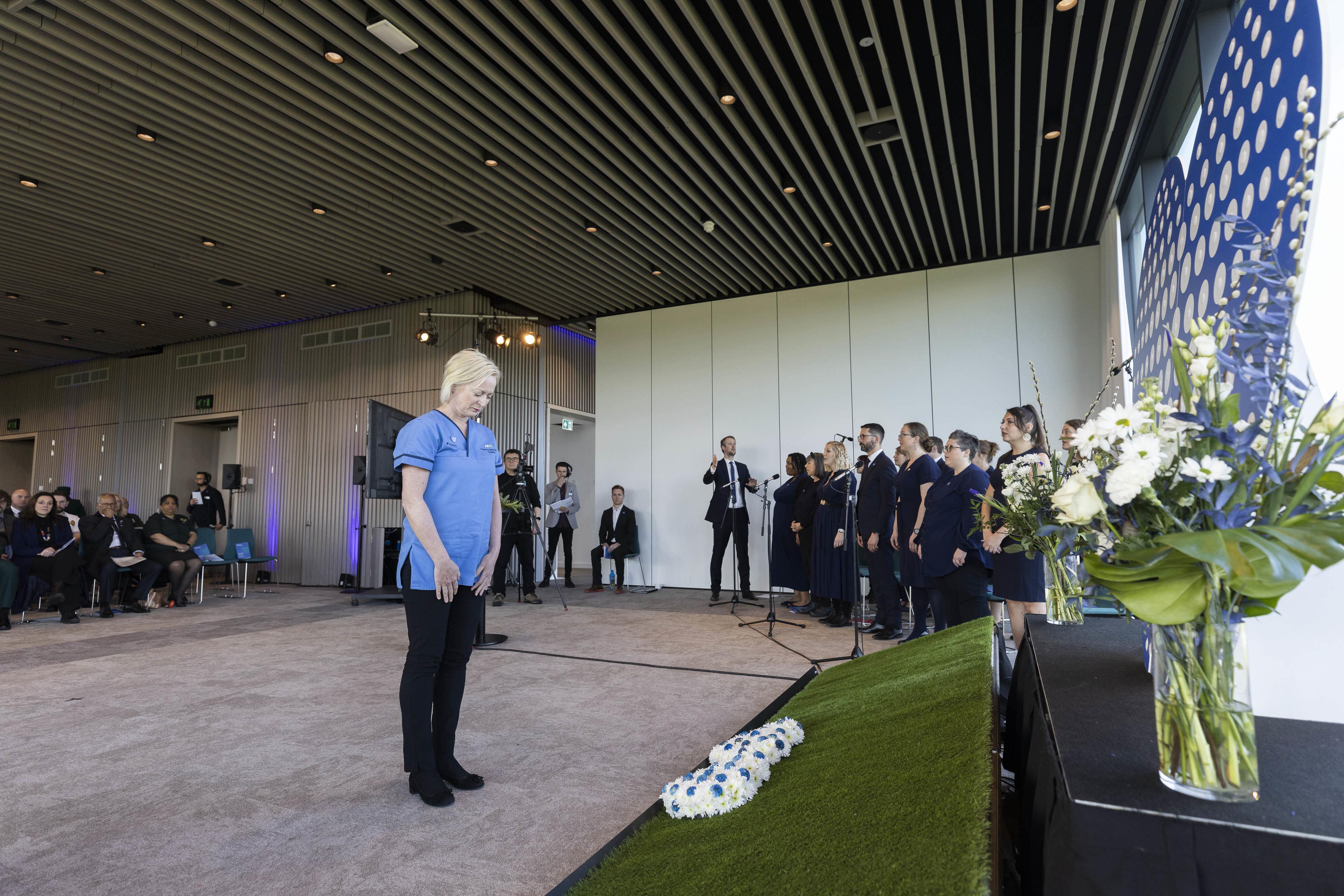 Dame Ruth May, chief nursing officer for NHS England, lays a wreath during a live broadcast memorial event hosted by NHS Charities Together at the National Memorial Arboretum in Staffordshire to mark the third anniversary of the World Health Organisation declaring a global Covid-19 pandemic (Fabio De Paola/PA)