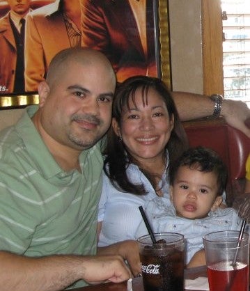 John Collado with his wife Amarilis and their son John Jay