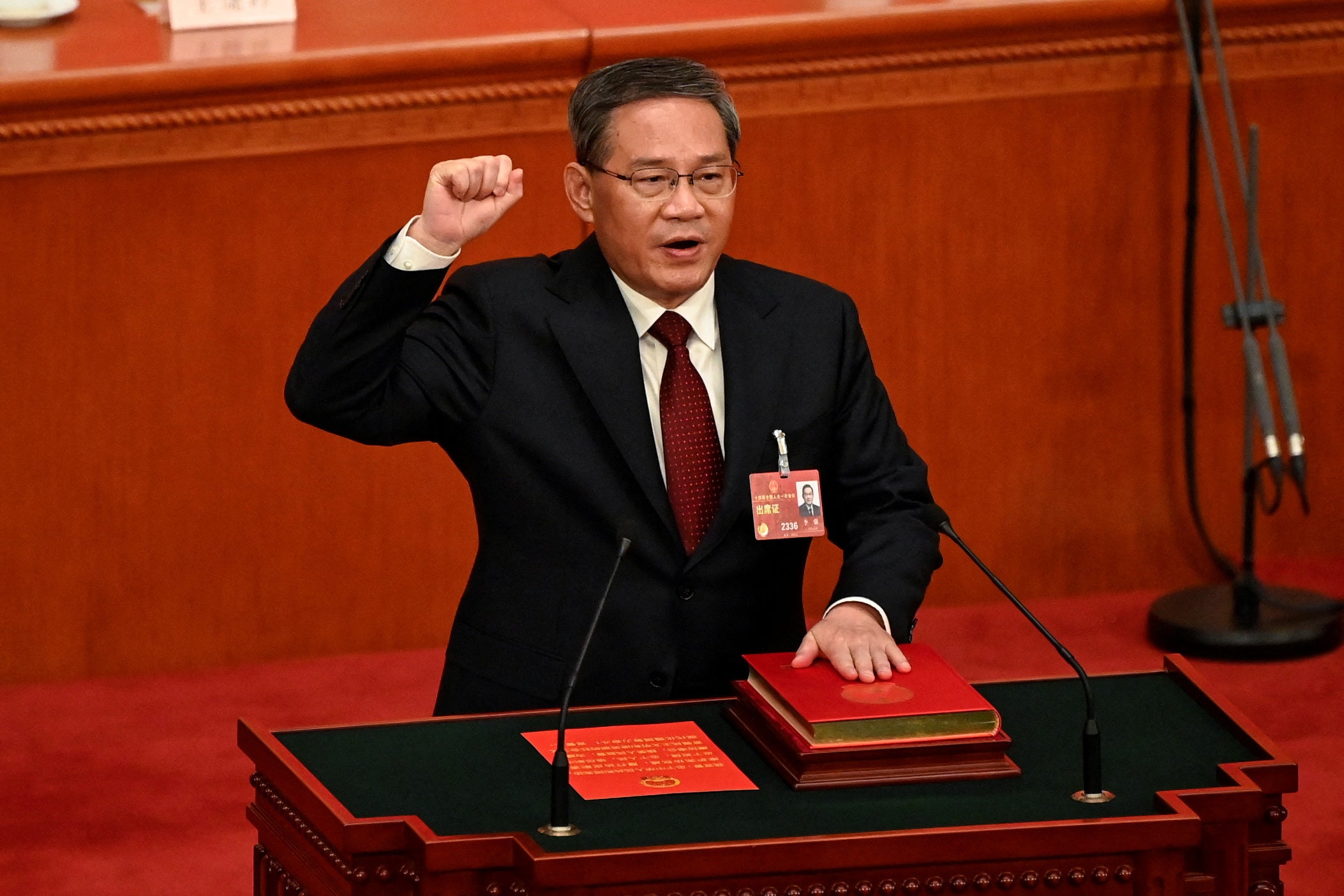 China’s new premier Li Qiang takes an oath after being elected during the fourth plenary session