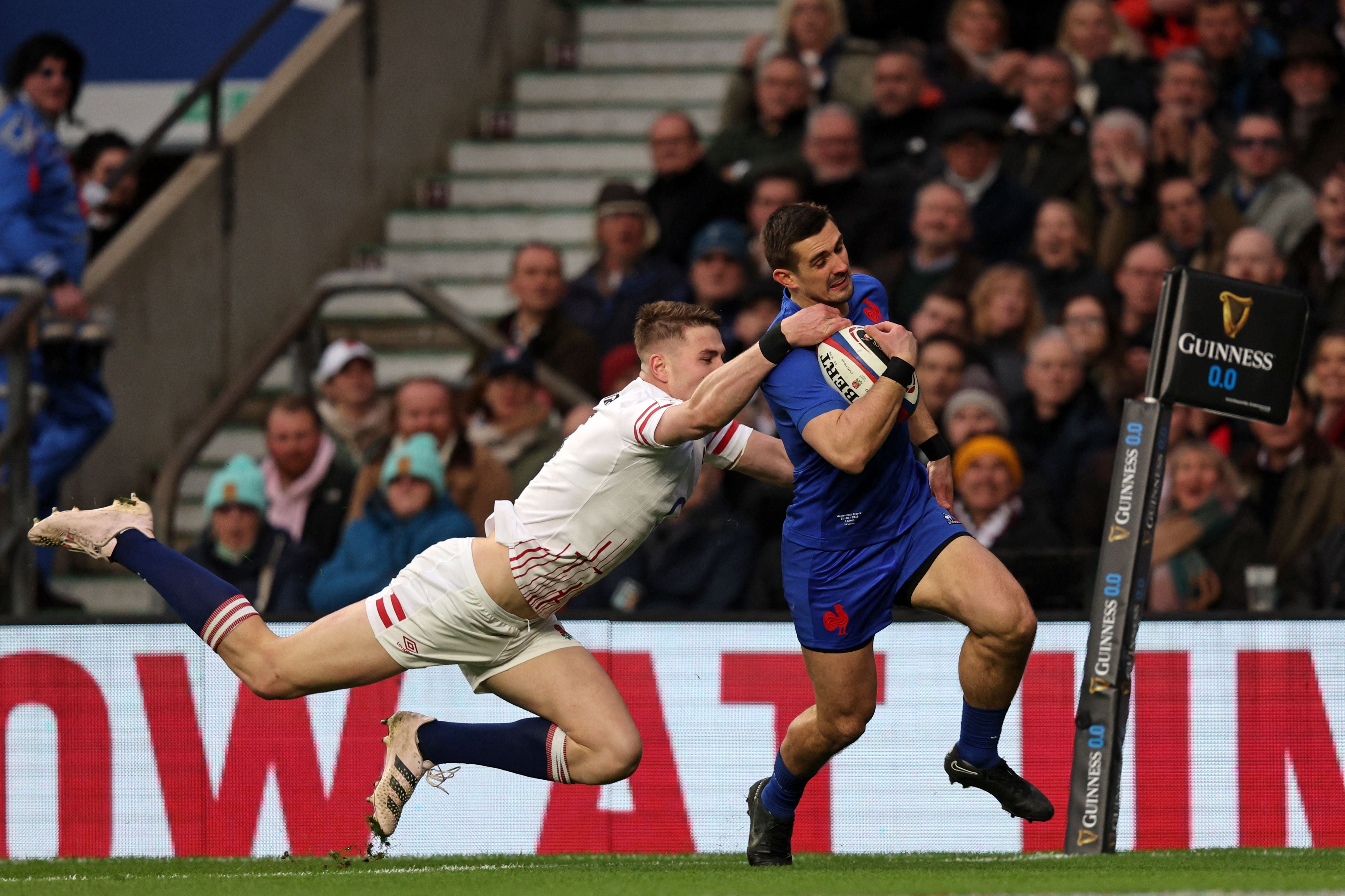 England full-back Freddie Steward cannot stop his opposite number Thomas Ramos from running in an early French try during the Six Nations last year