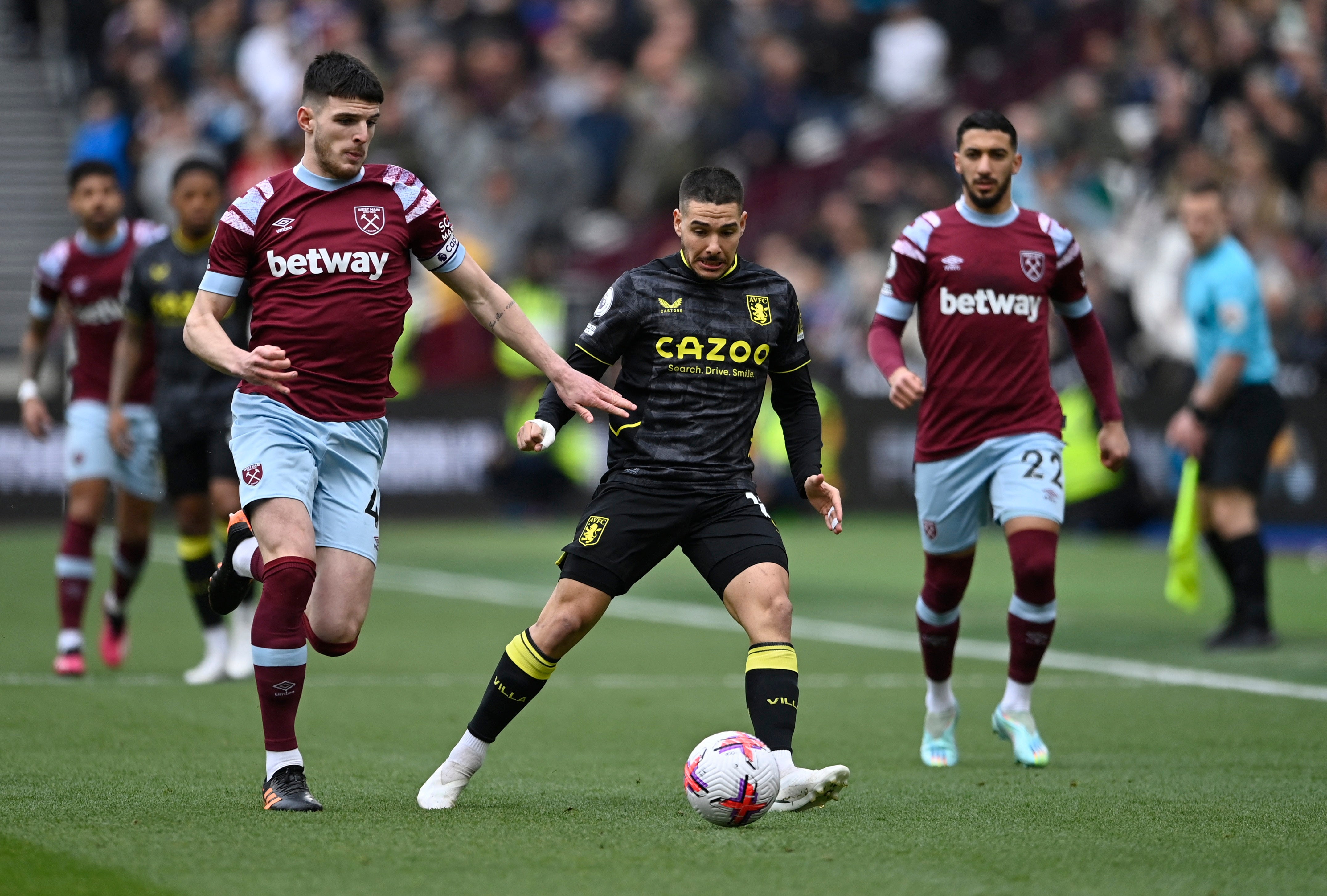 West Ham captain Declan Rice challenges Emi Buendia in midfield