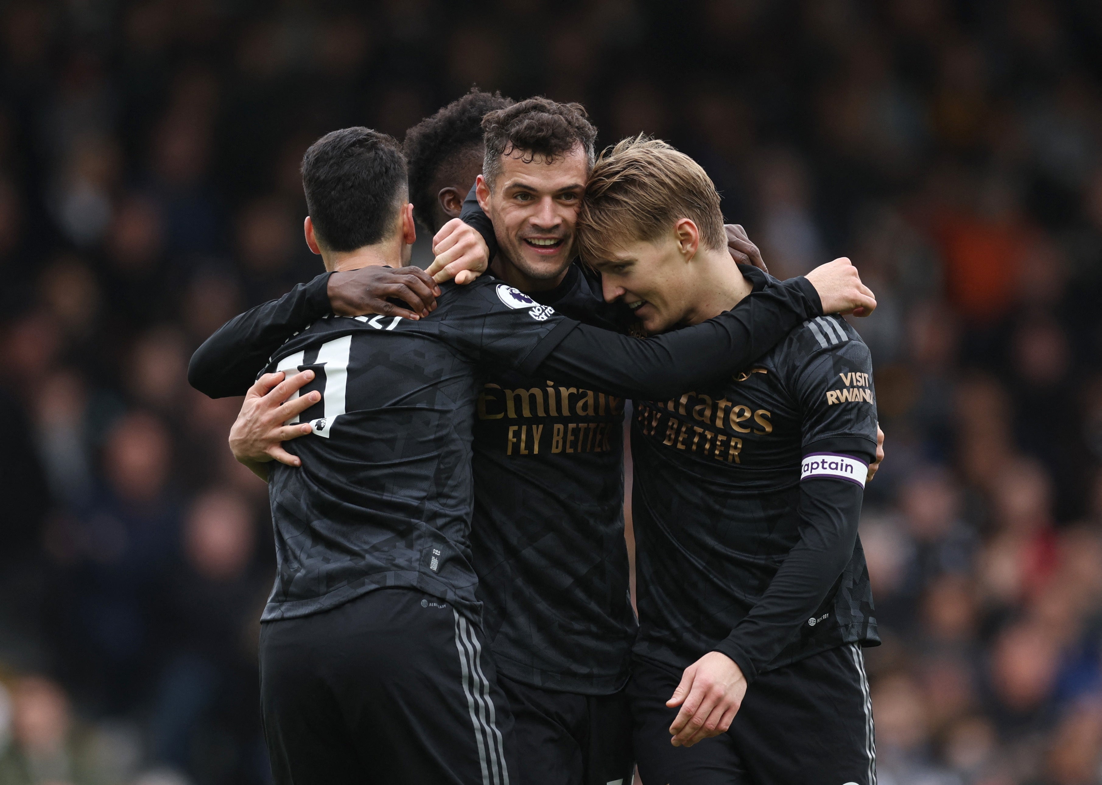 Arsenal celebrate after scoring against Fulham