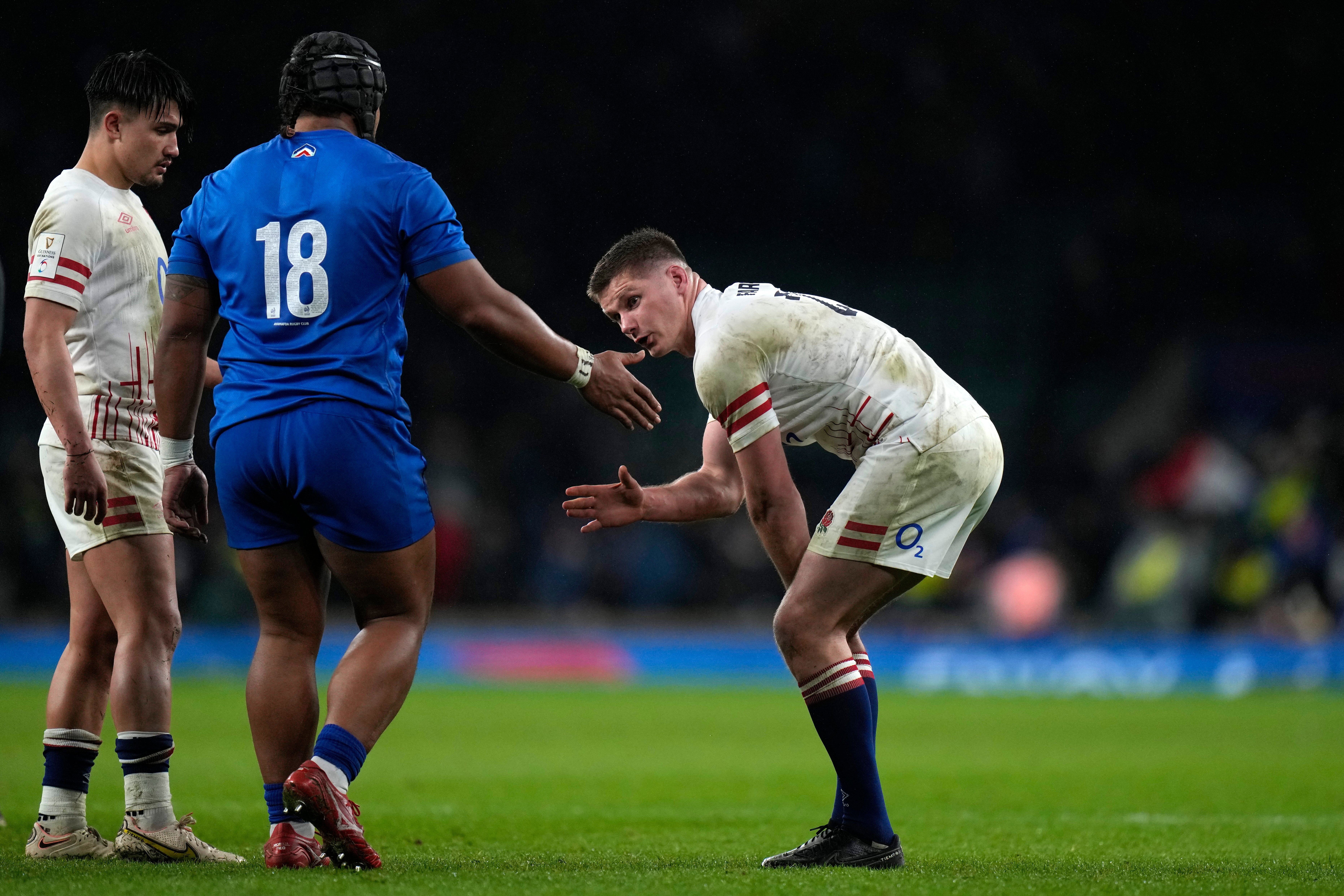 Owen Farrell is commiserated by Sipili Falatea after the match