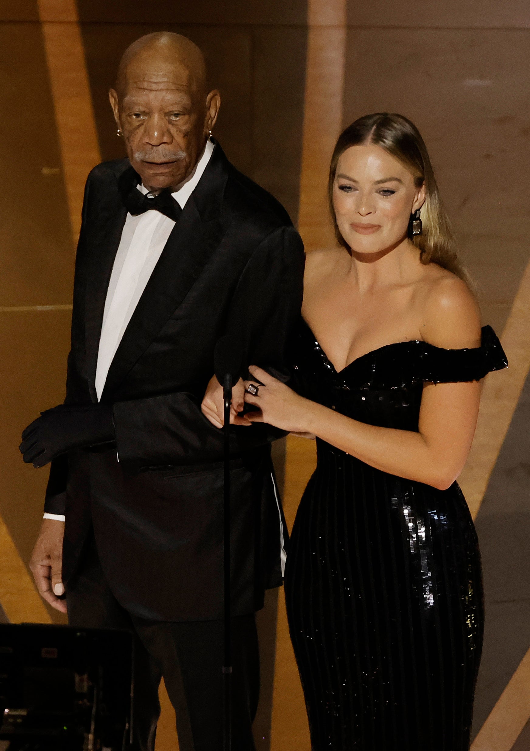 Morgan Freeman and Margot Robbie speak onstage during the 95th Annual Academy Awards