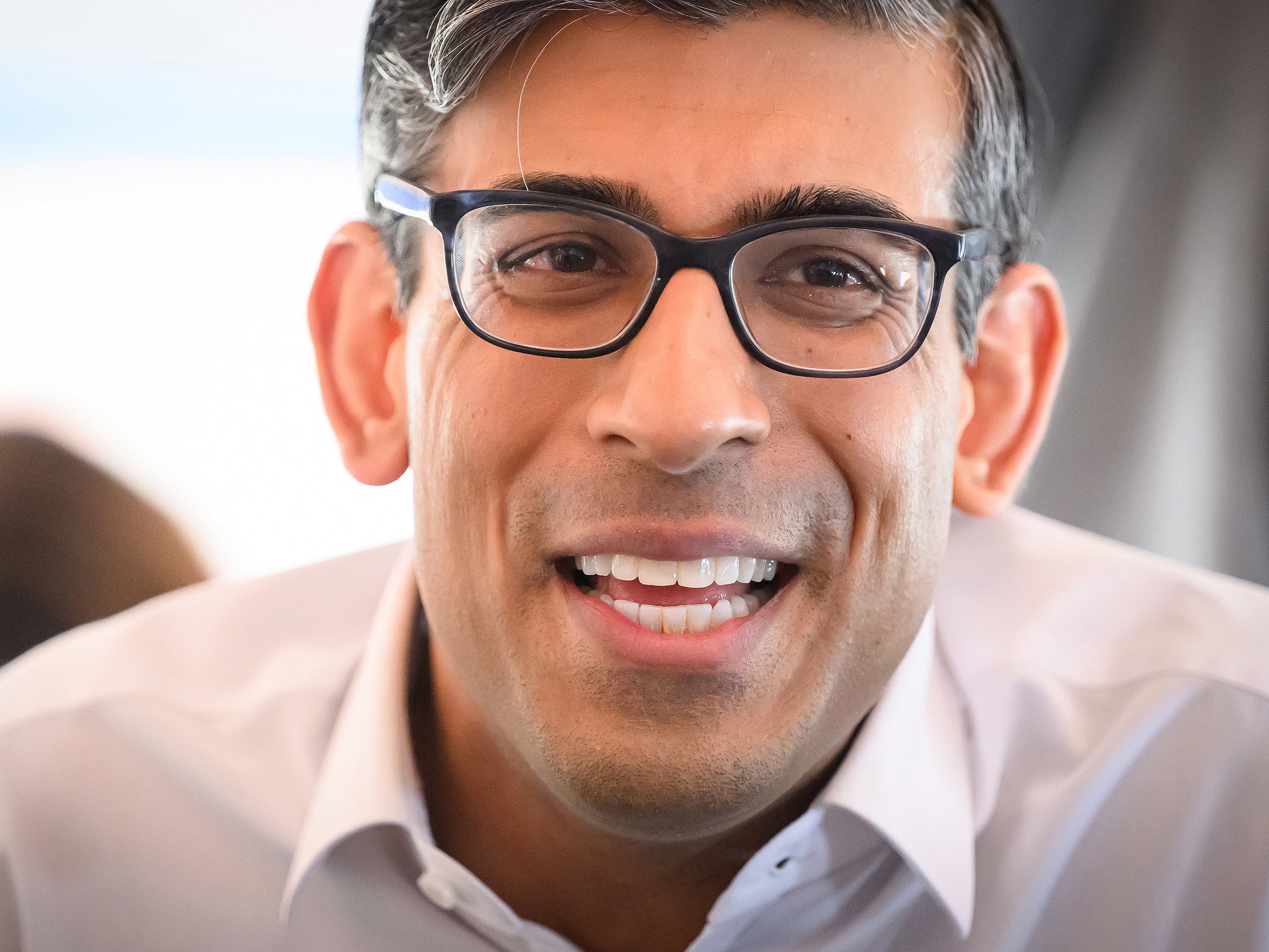 Rishi Sunak speaks to members of the travelling media during his flight to US