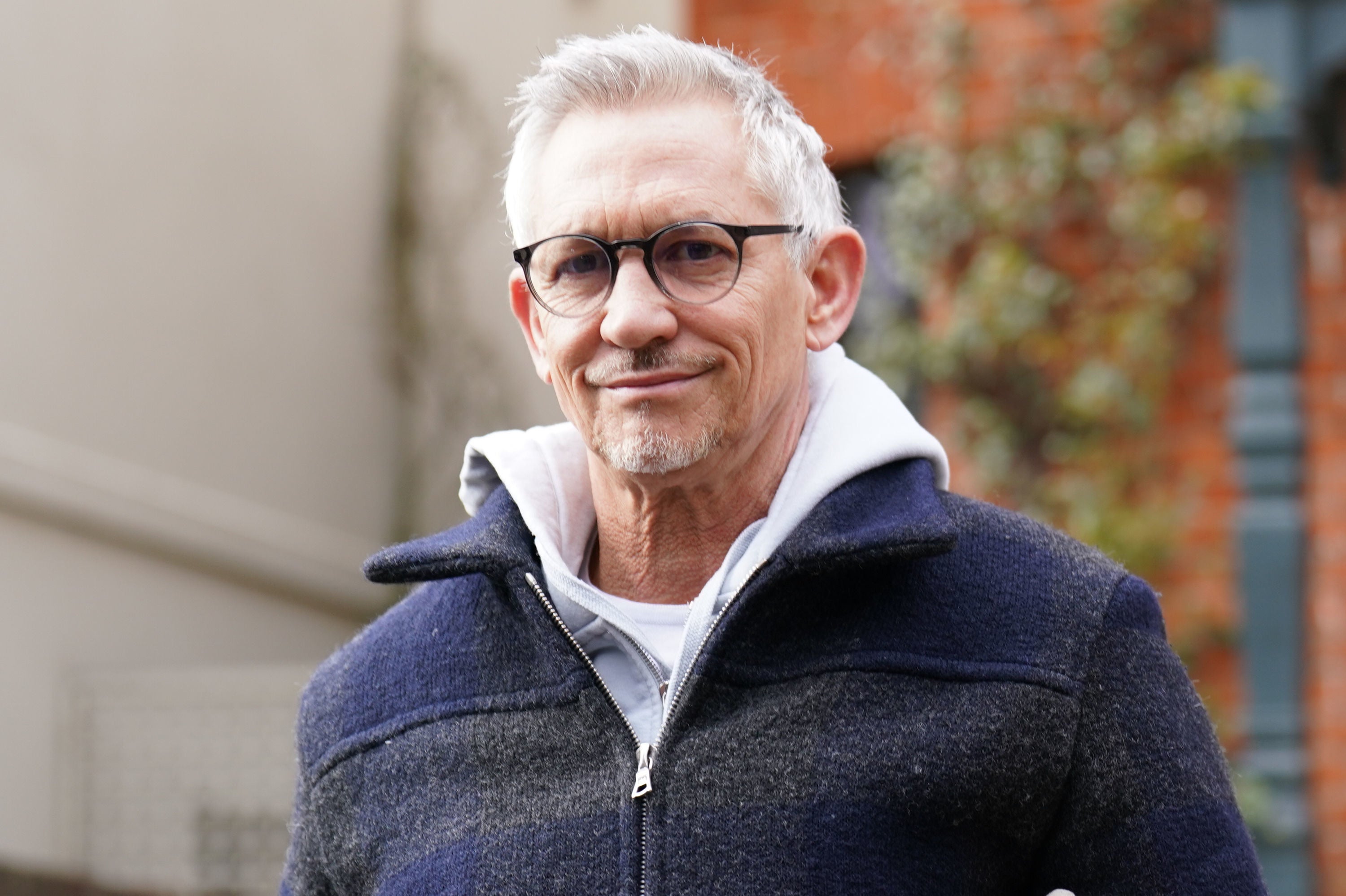 Gary Lineker smiles as he leaves his home following the announcement he would return to the BBC