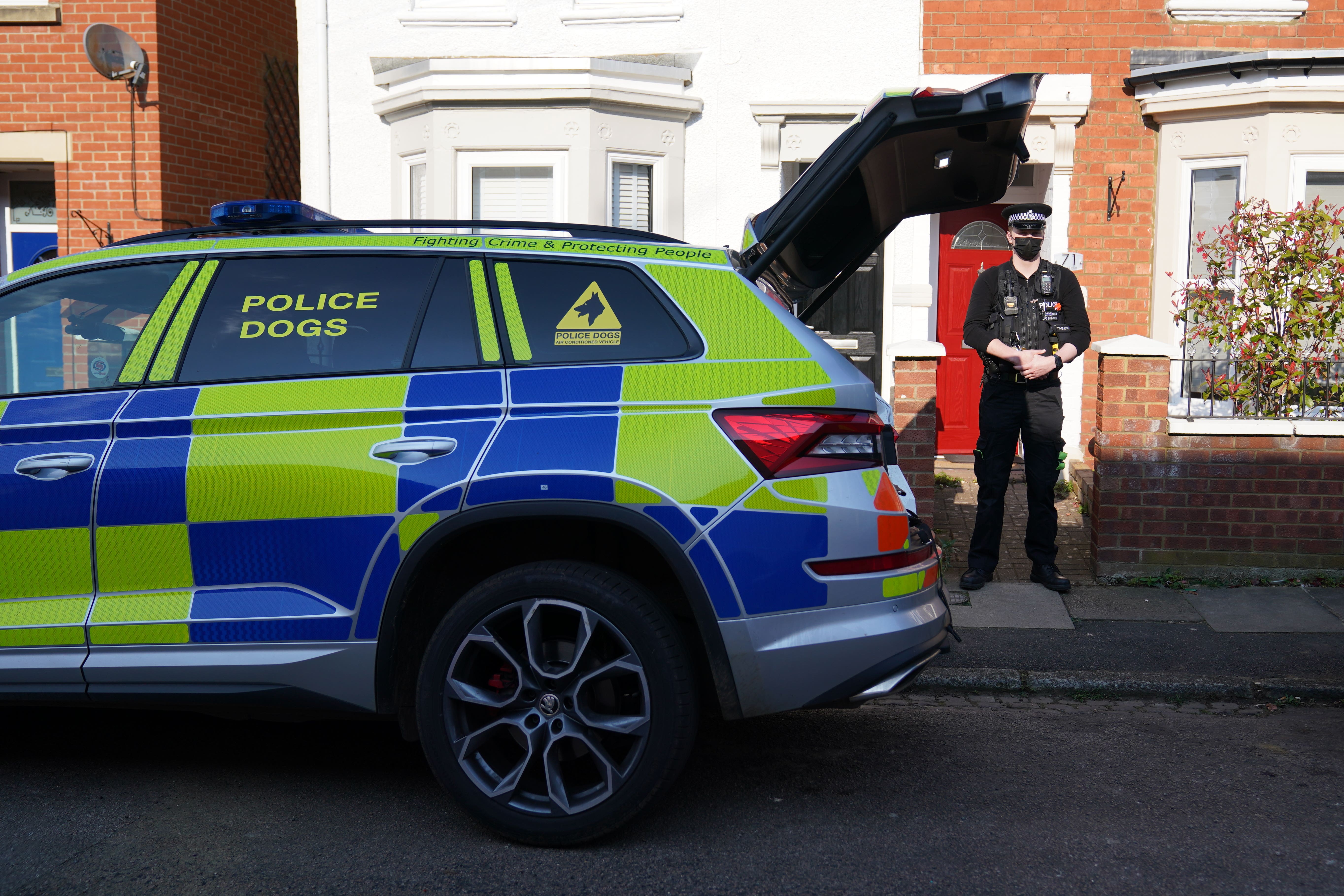 Police at the scene in Moore Street, Kingsley, Northampton following a discovery of a body in a rear garden (Jacob King/PA)