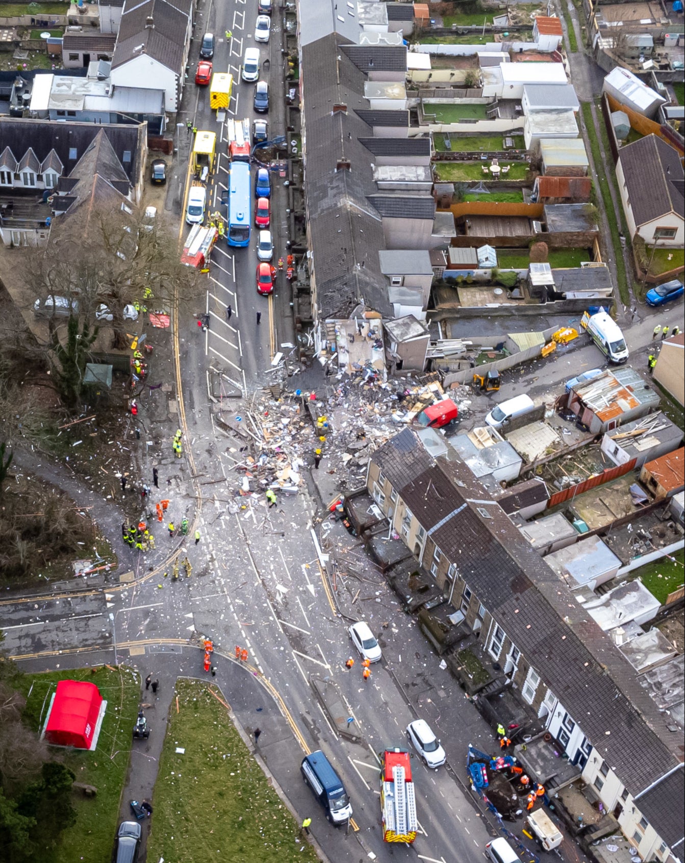 A neighbour has described pulling a woman and her son from the rubble