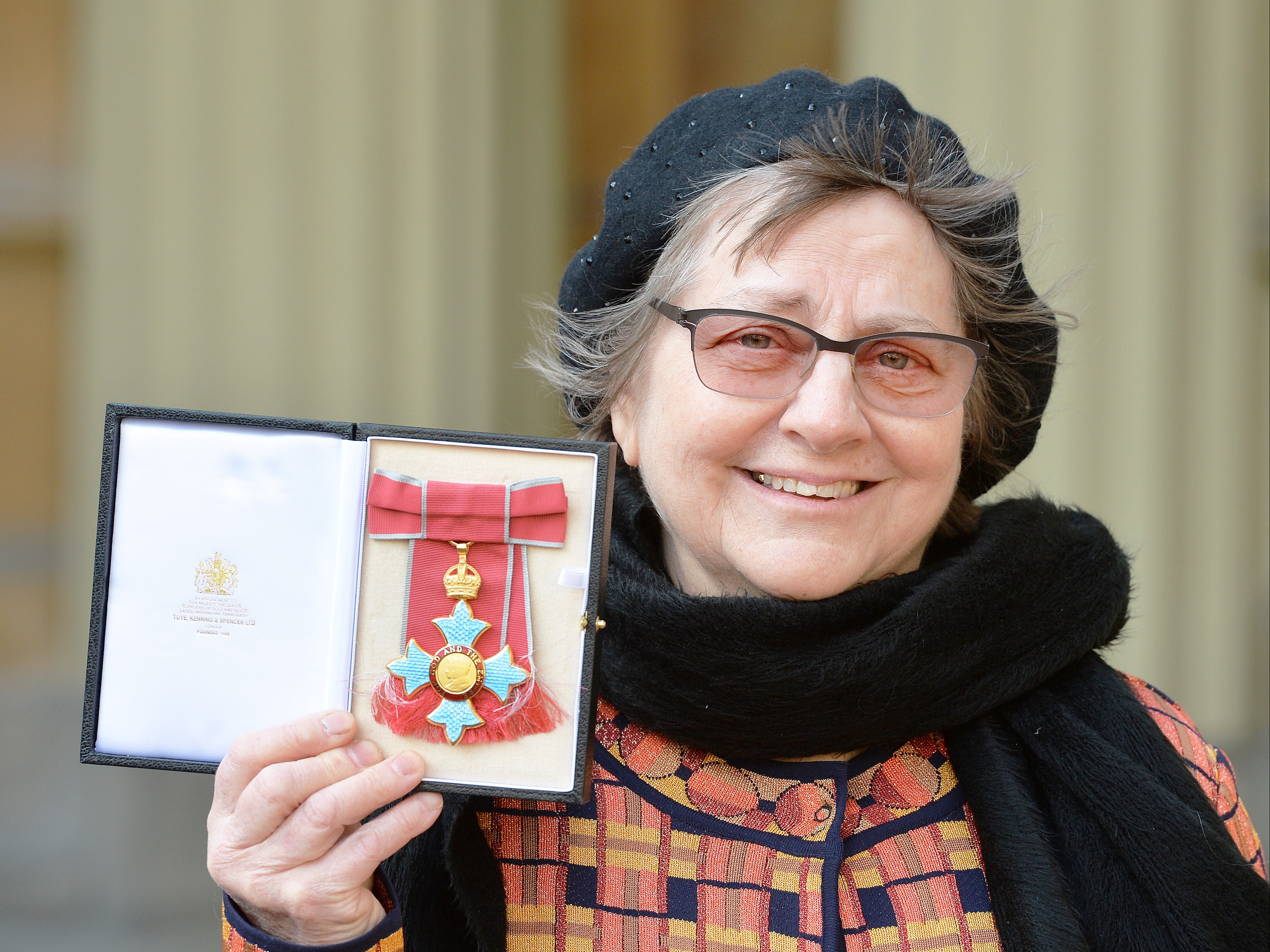 Sculptor Phyllida Barlow holds her CBE medal presented by Prince Charles in 2016