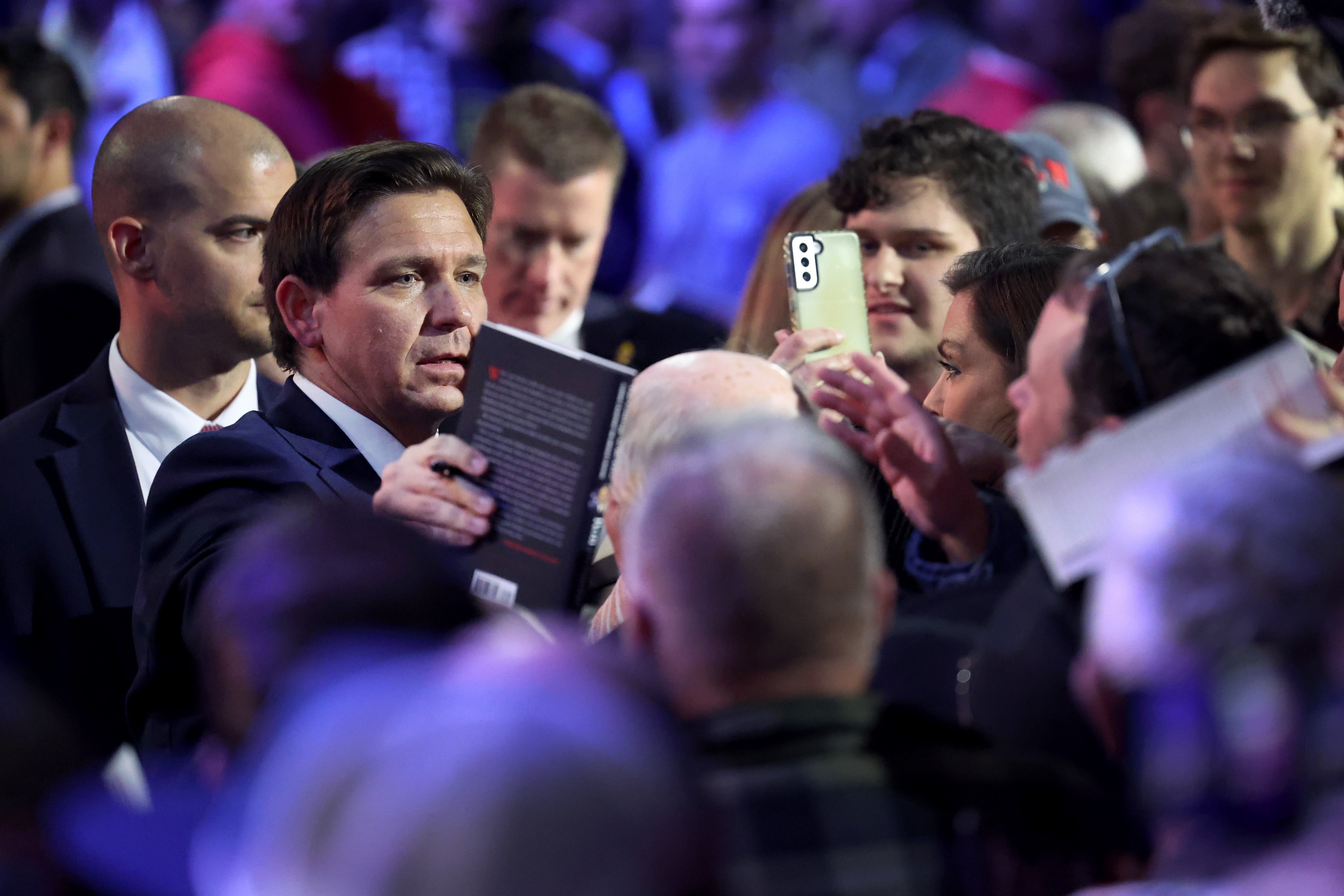 Florida Gov. Ron DeSantis signs copies of his book after speaking to Iowa voters during an event at the Iowa State Fairgrounds on March 10, 2023 in Des Moines, Iowa