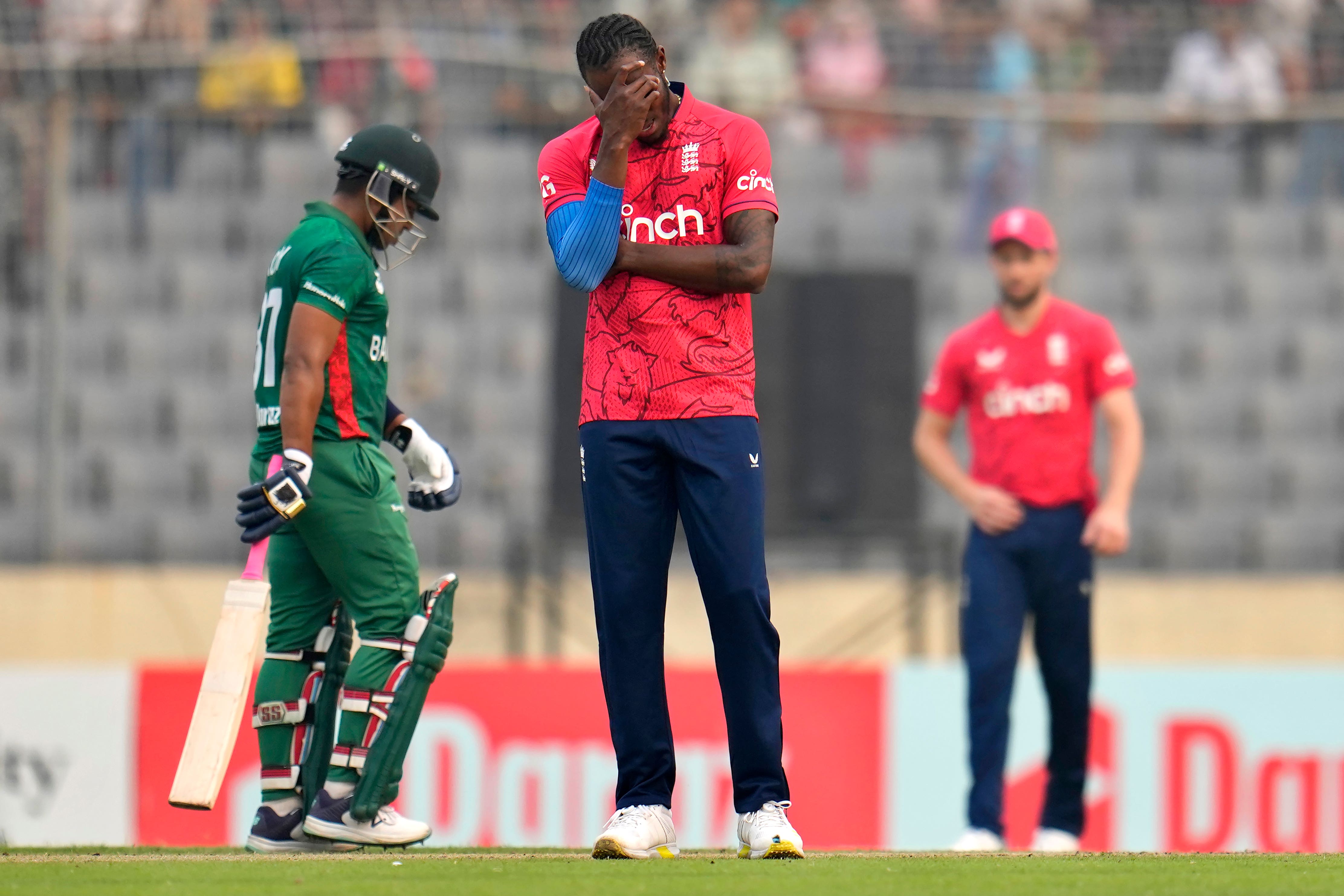 Jofra Archer (centre) reacted after Rehan Ahmed dropped a catch (Aijaz Rahi/AP)