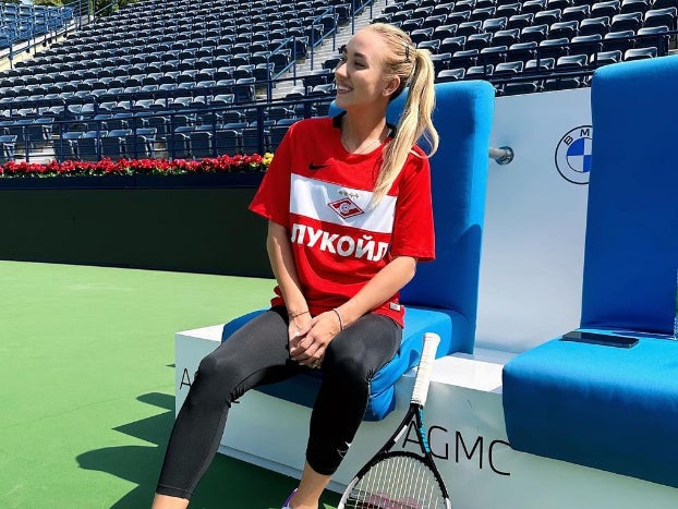 Anastasia Potapova wearing a Spartak Moscow shirt