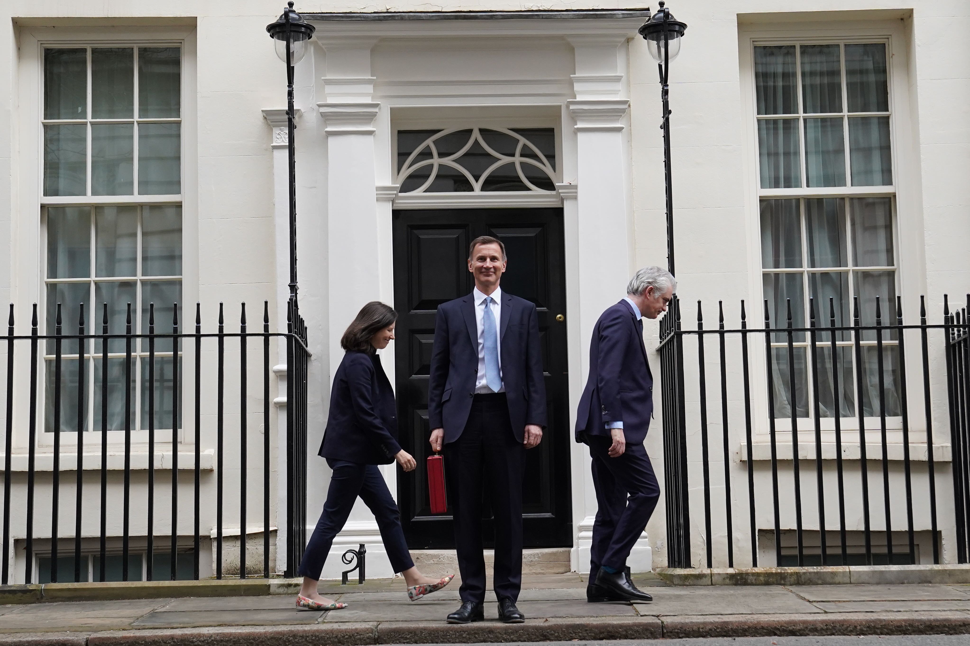 Chancellor of the Exchequer Jeremy Hunt leaves 11 Downing Street to deliver his Budget at the Houses of Parliament (Stefan Rousseau/PA)