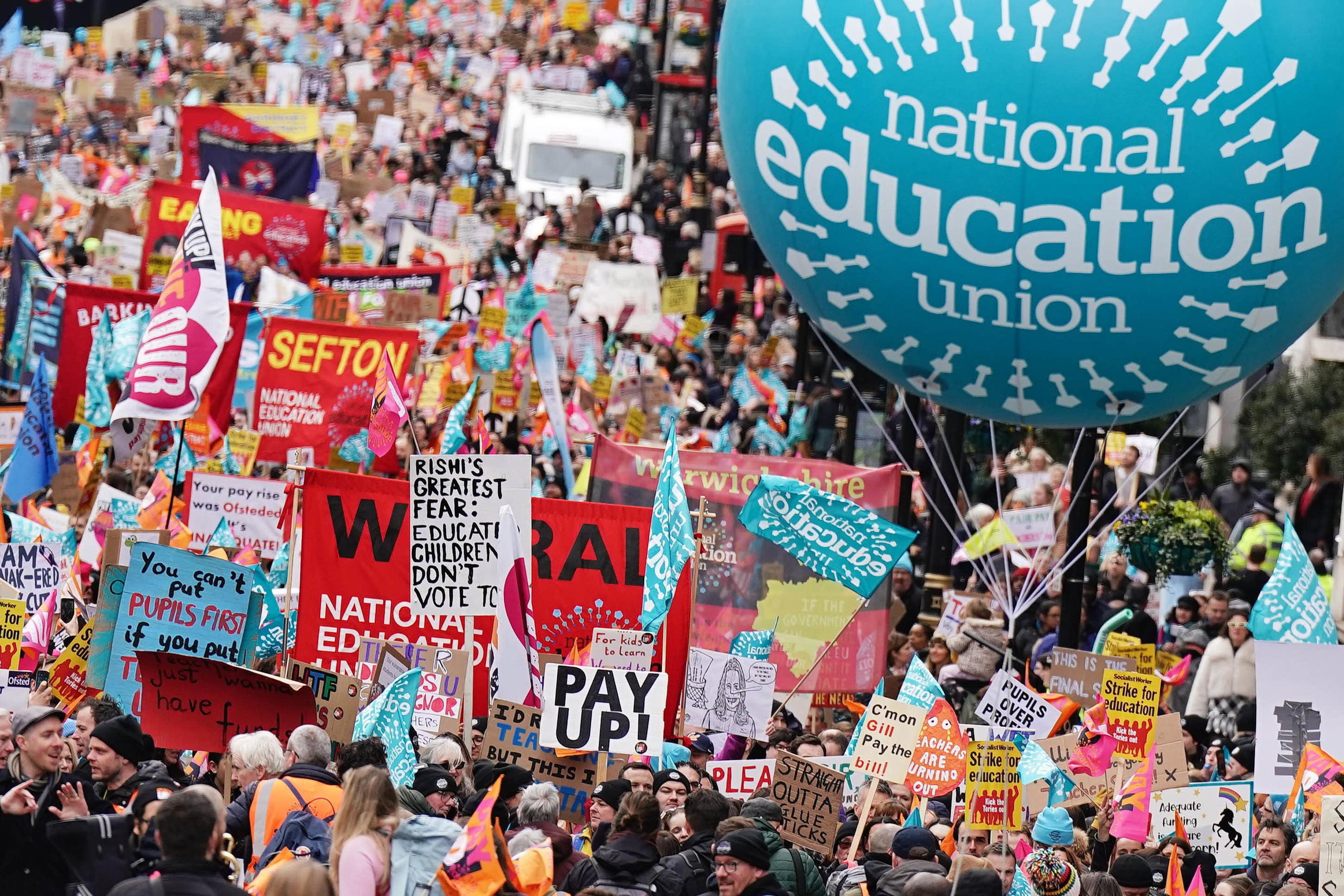 PABest Striking members of the National Education Union (NEU) on Piccadilly march to a rally in Trafalgar Square, central London, in a long-running dispute over pay. Picture date: Wednesday March 15, 2023.