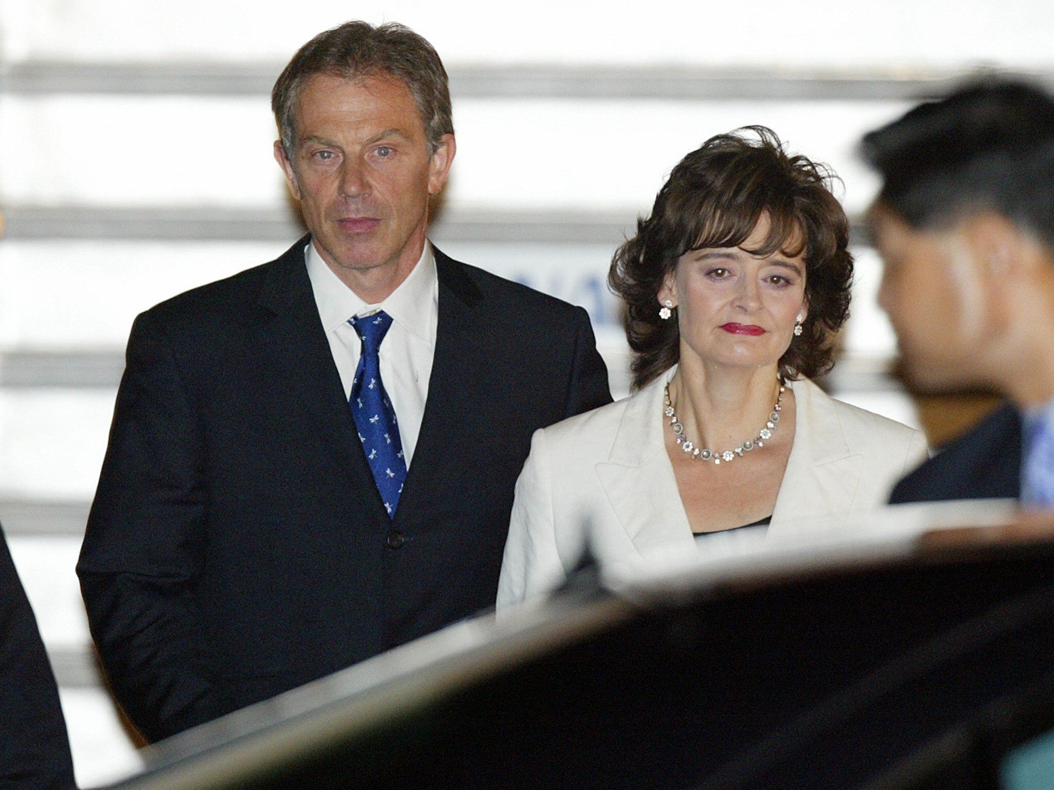 Tony Blair arrives in Japan with his wife, Cherie, in July 2003