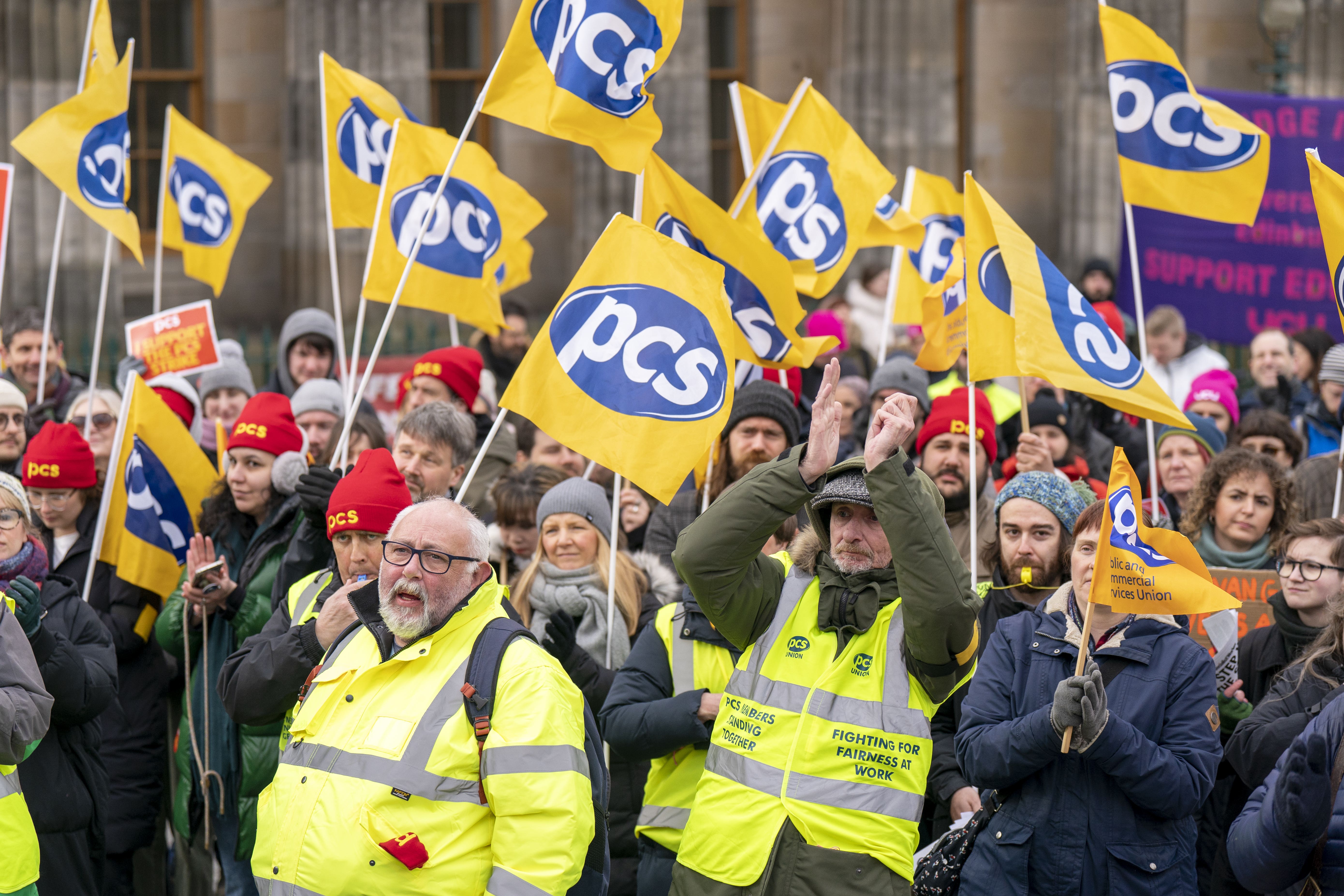 PCS members staged a rally as they walked out on strike (Jane Barlow/PA)