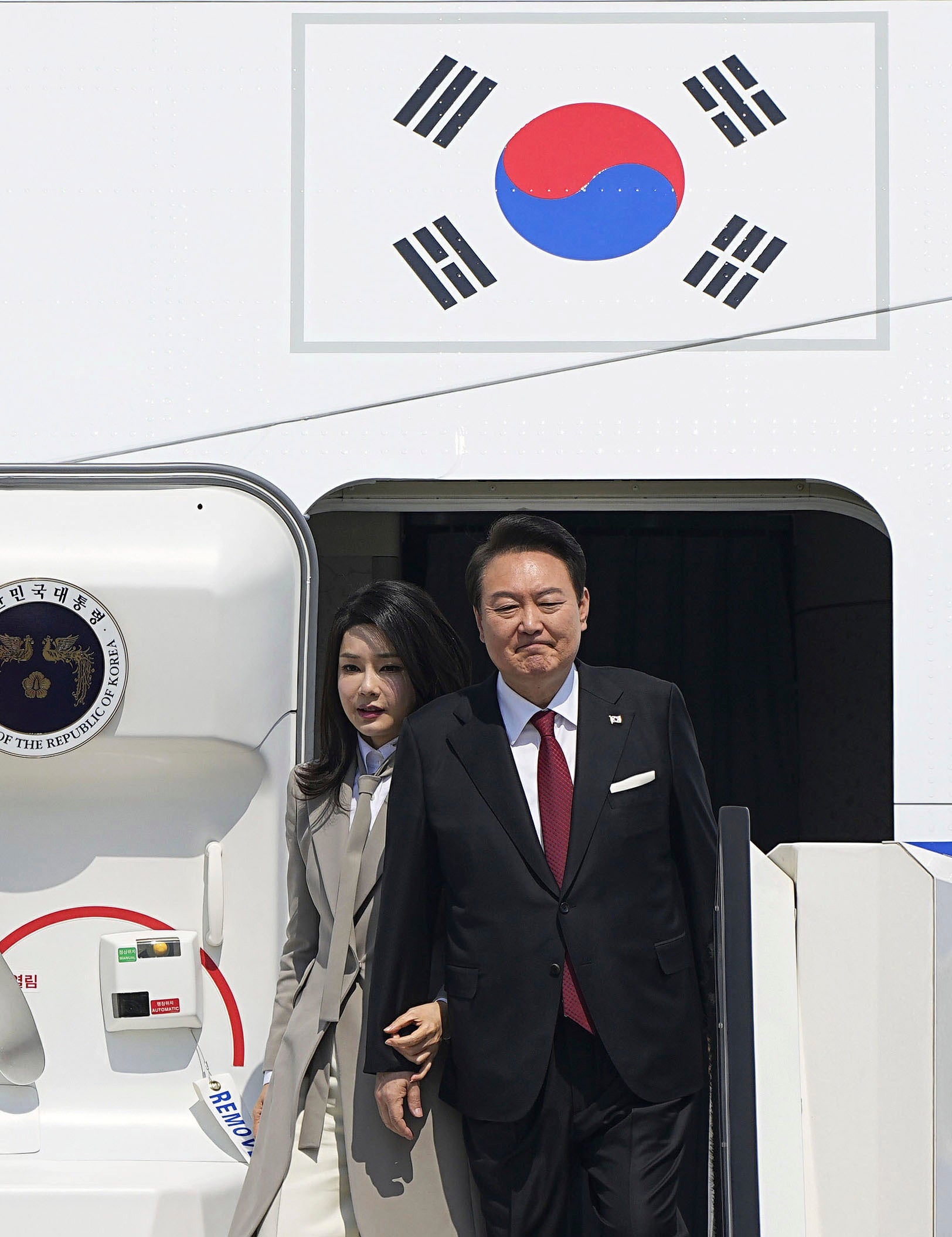 South Korean President Yoon Suk Yeol and his wife Kim Keon Hee arrive at Haneda International Airport in Tokyo,