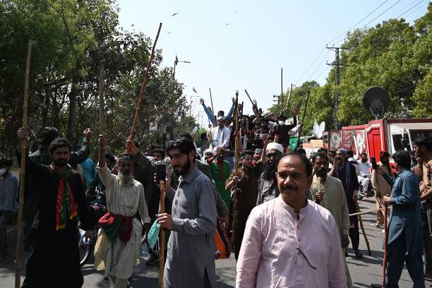 Supporters of former Pakistan’s prime minister Imran Khan march towards his residence in Lahore