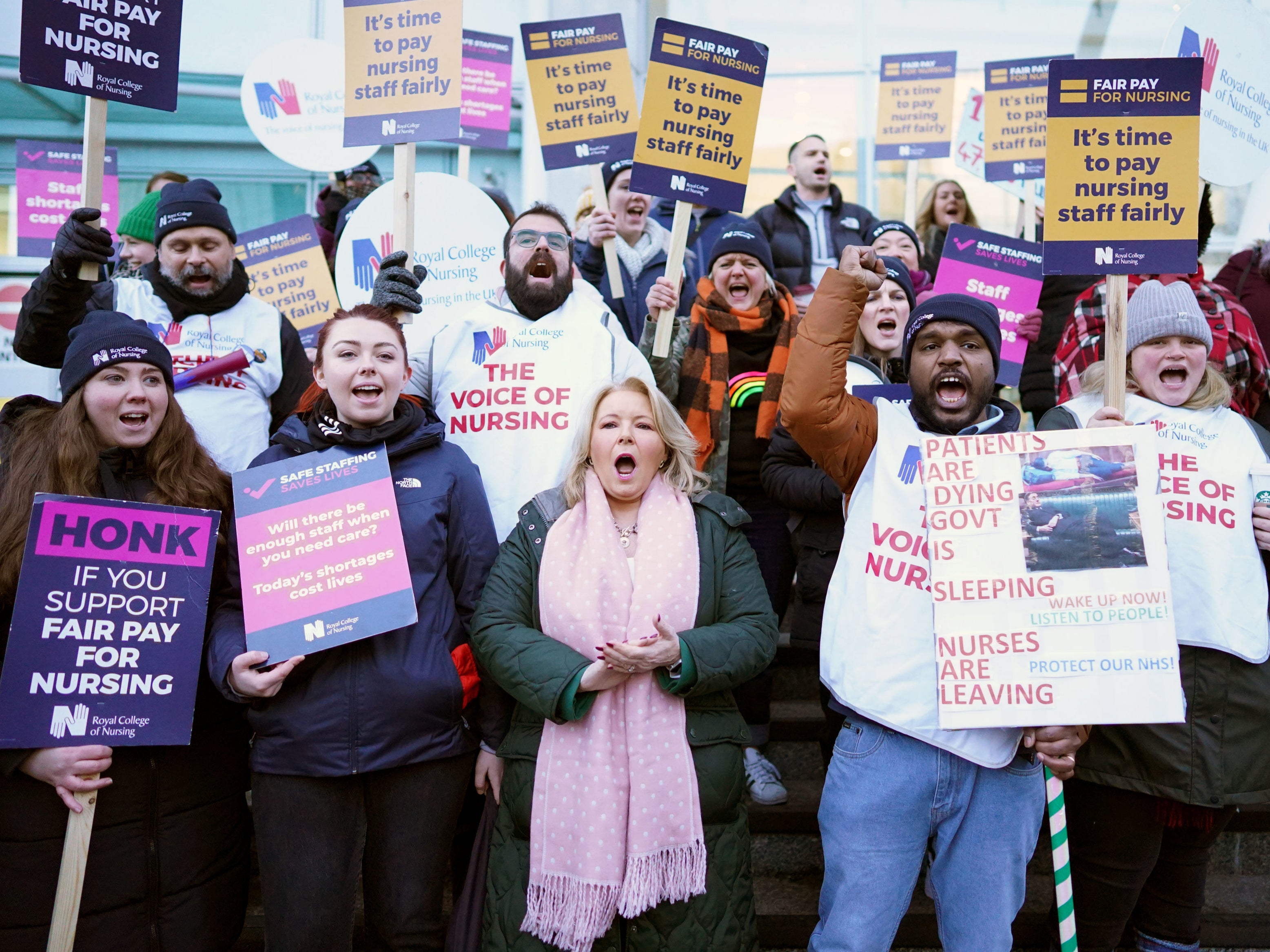 Royal College of Nursing boss Pat Cullen (bottom row, centre) joins RCN members on the picket line outside University College Hospital, London, in January