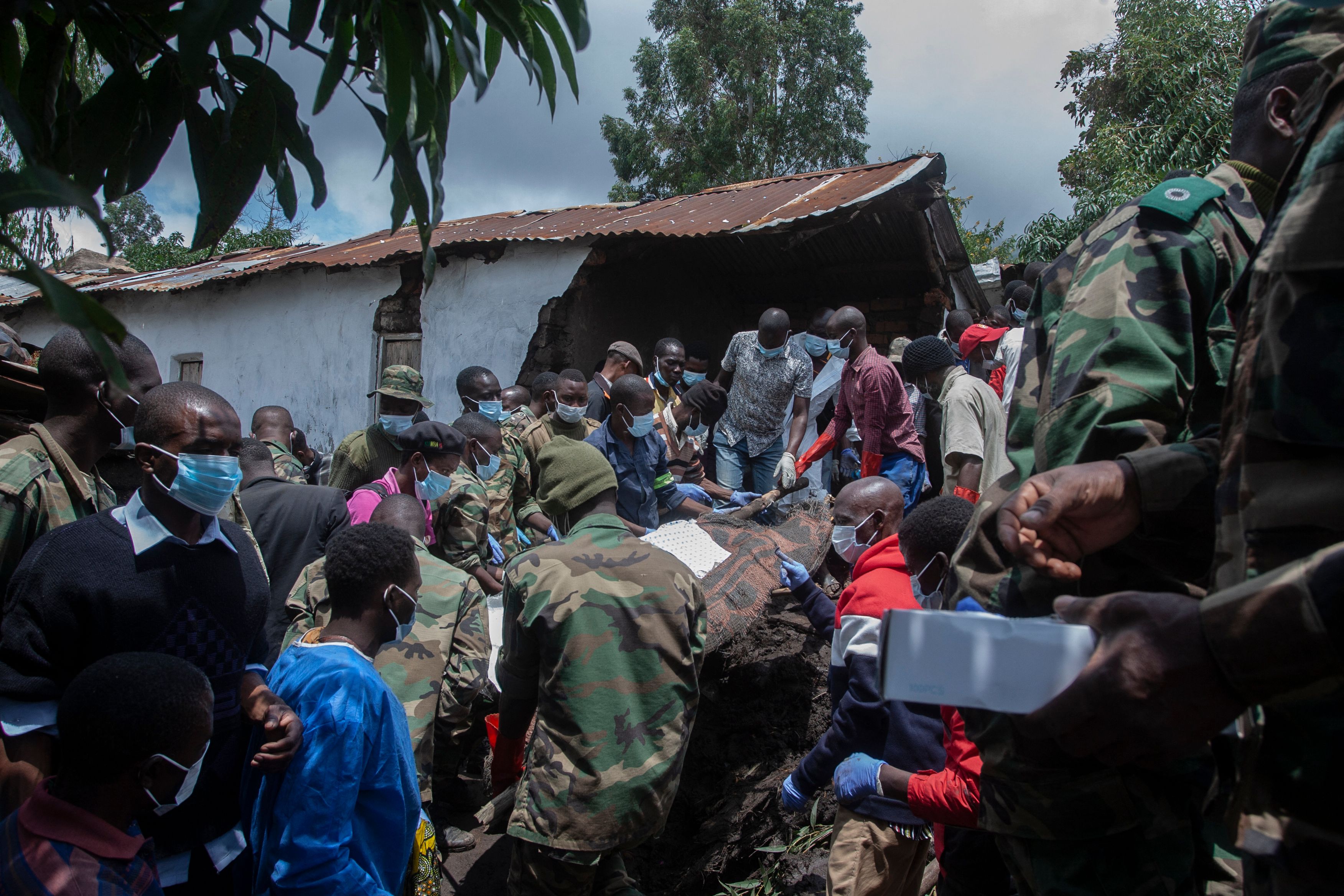 Malawi Defence Force soldiers recover a body of a landslip victim on Thursday in the wake of Cyclone Freddy