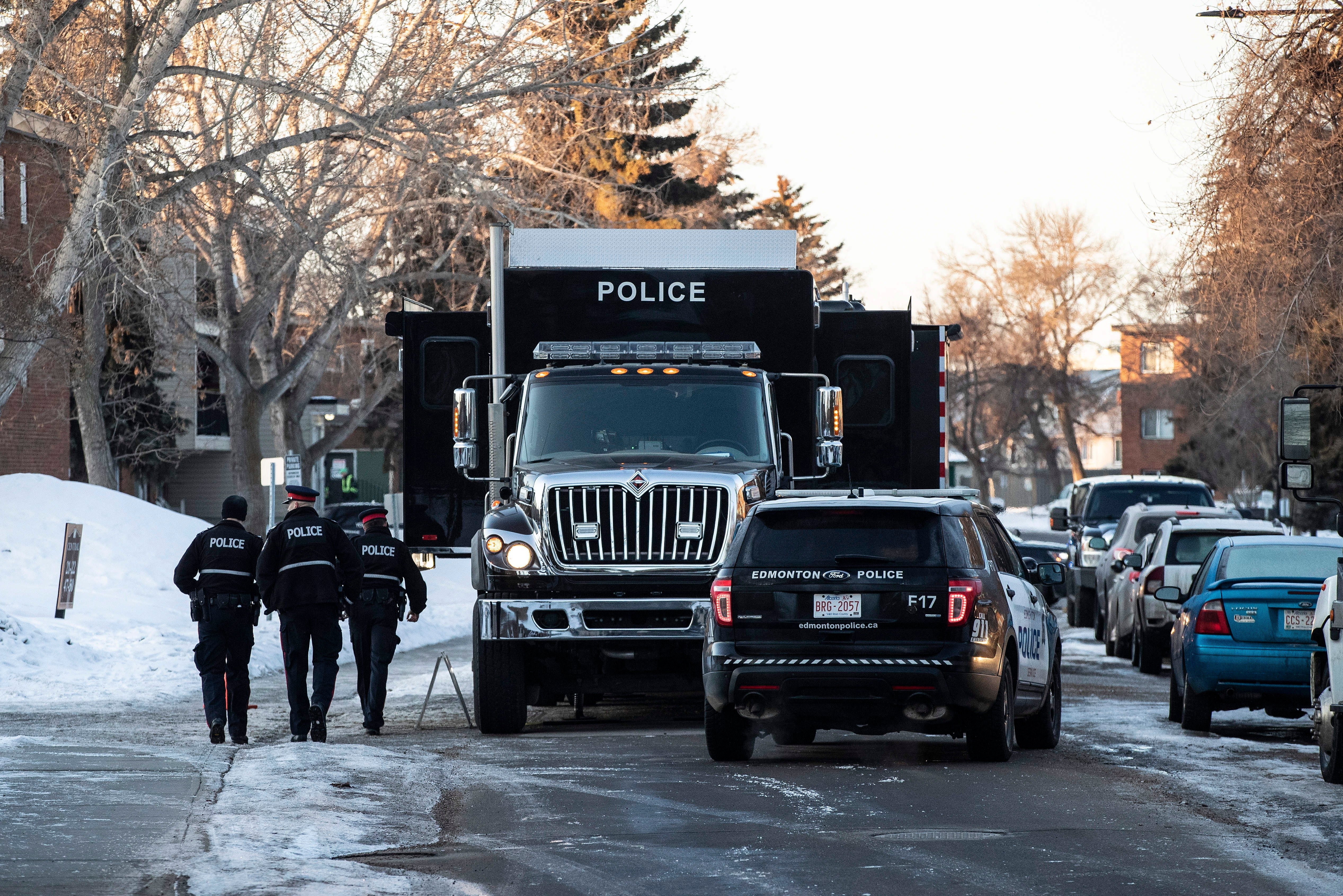 Police investigate the scene where two officers were shot and killed on duty in Edmonton on Thursday, March 16, 2023