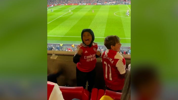 Kim Kardashian films son Saint cheering for Arsenal during surprise football game appearance