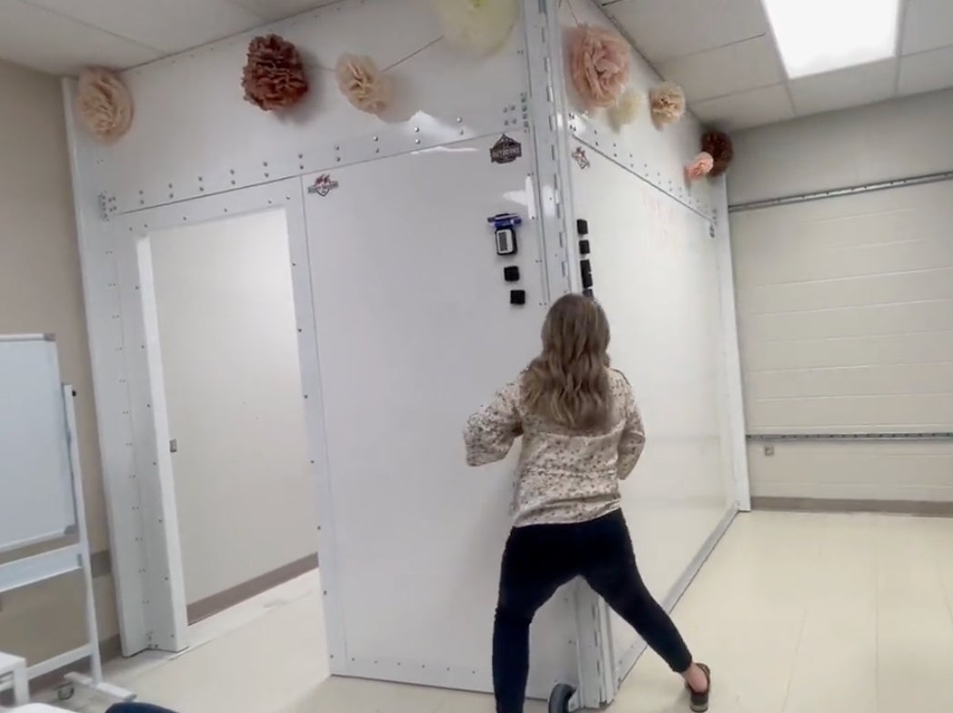 An Alabama teacher demonstrates the use of a whiteboard that can turn into a storm shelter and bulletproof safety room