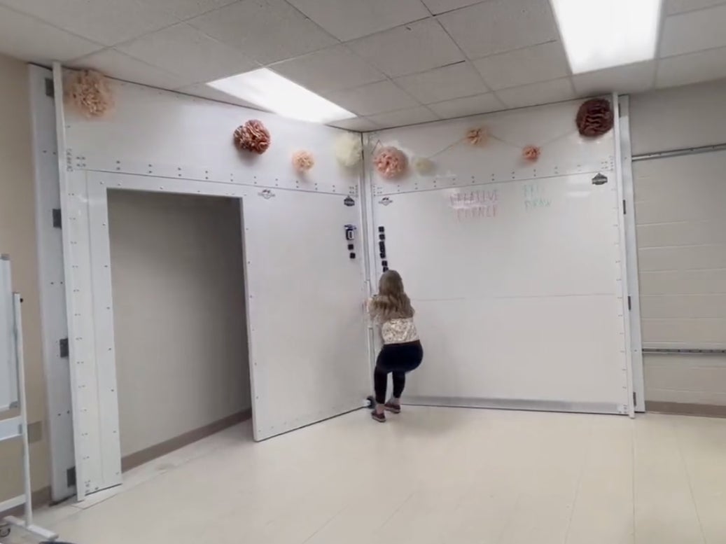 An Alabama teacher demonstrates the use of a whiteboard that can turn into a storm shelter and bulletproof safety room