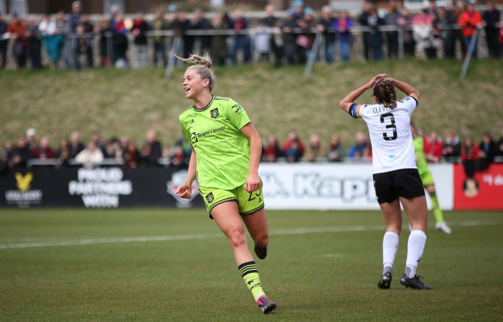 Alessia Russo of Manchester United celebrates the team's first goal, an own goal scored by Rhian Cleverly of Lewes